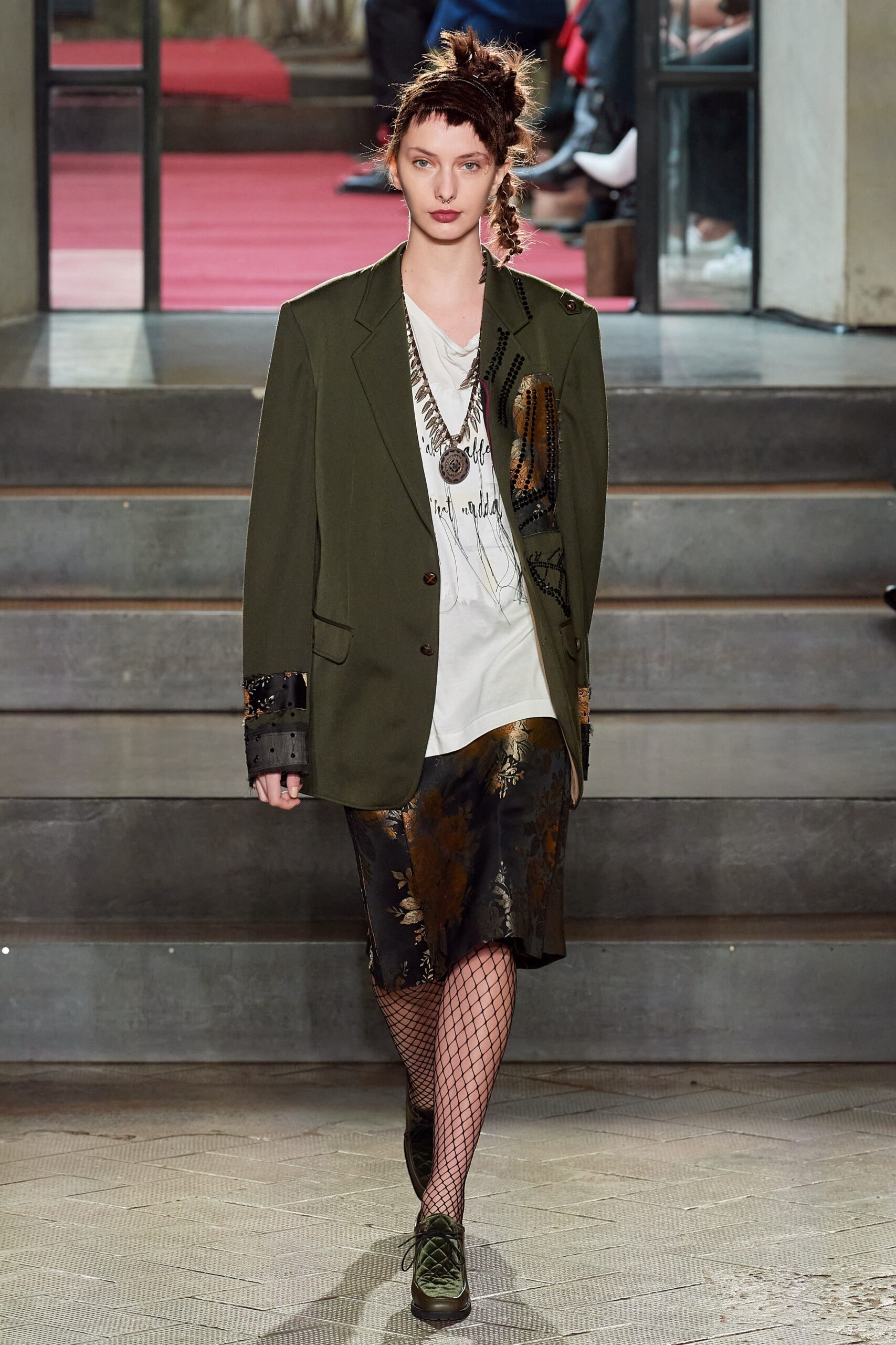 green relaxed blazer with black skirt