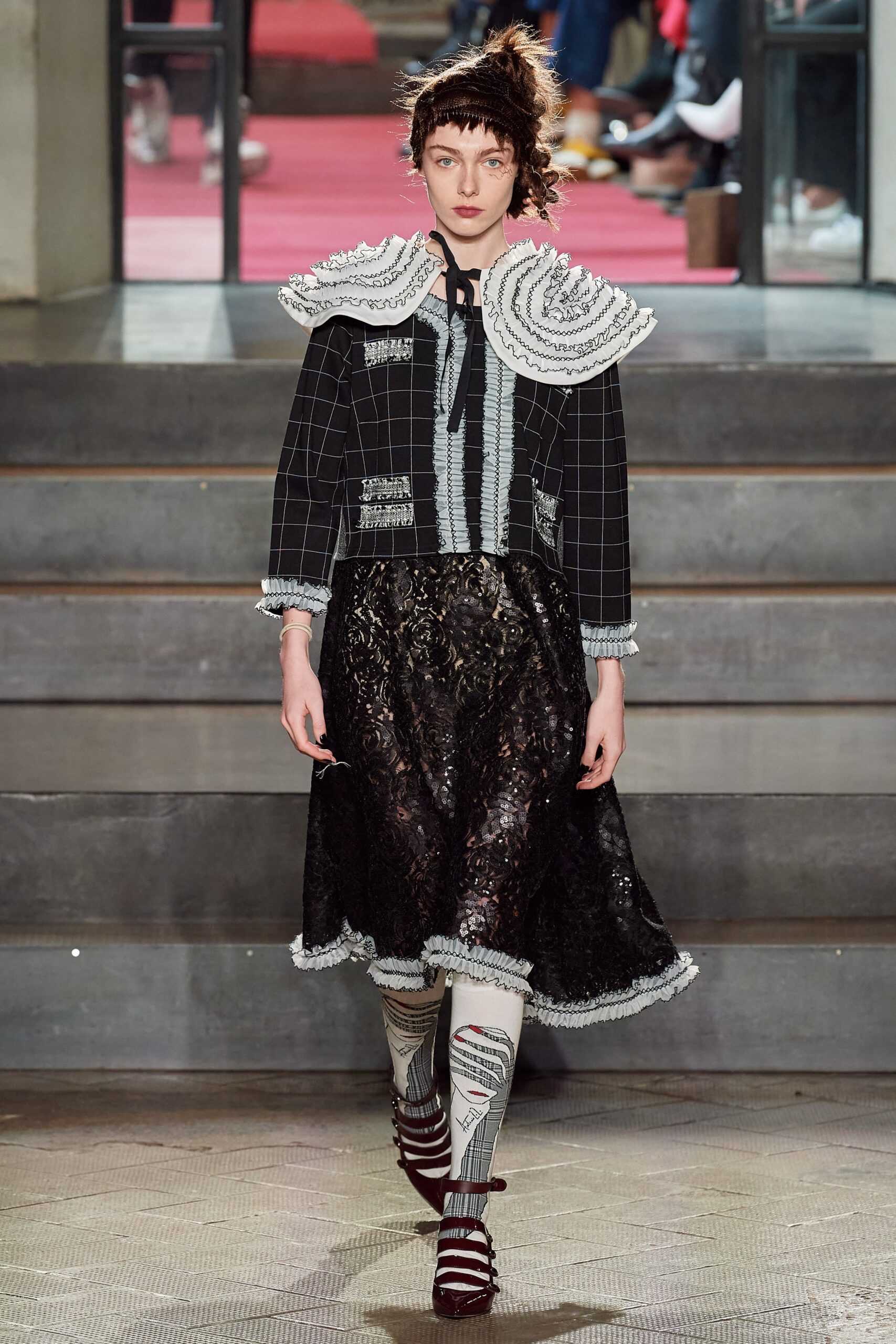black and white fitted jacket with lace skirt