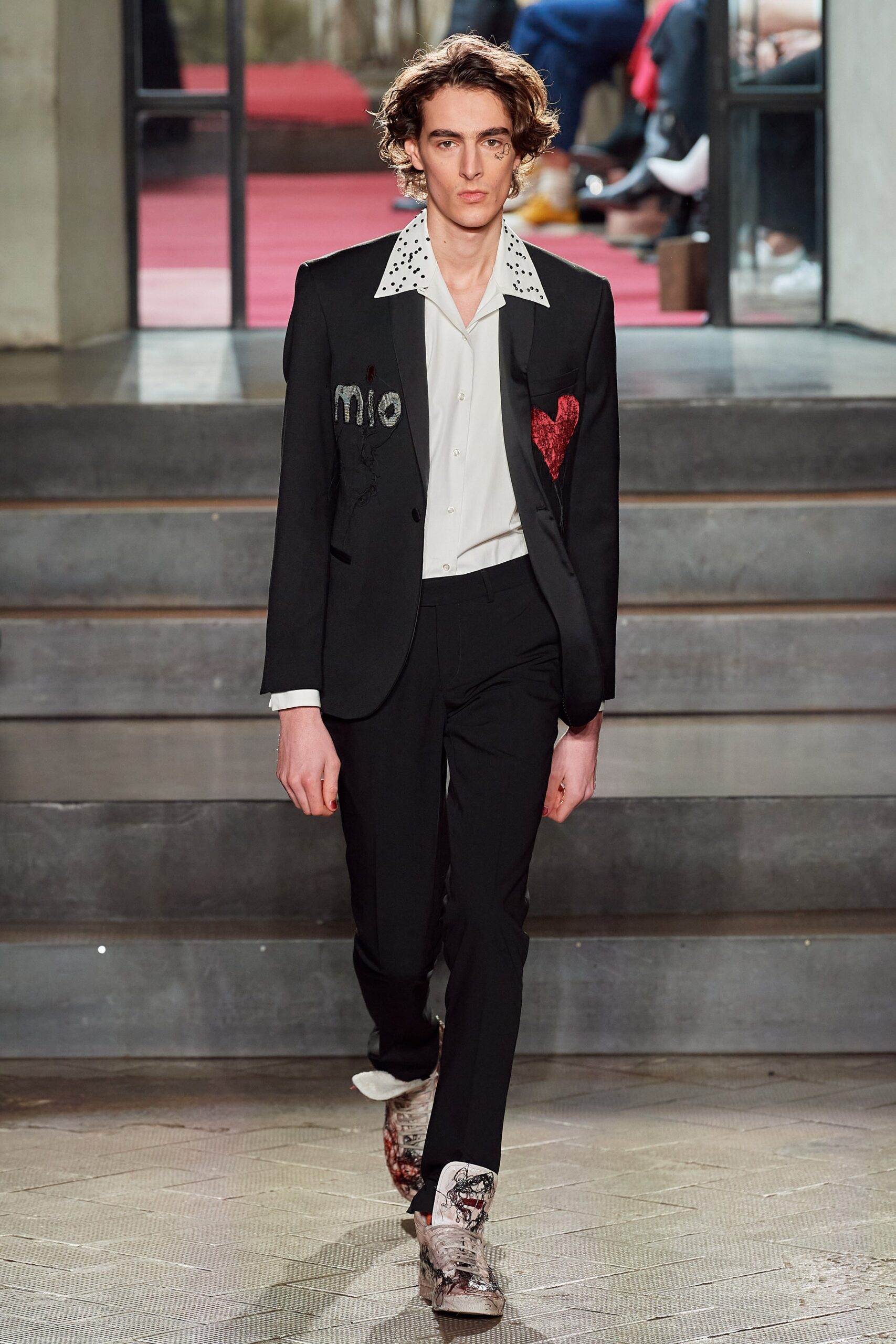 black tailored suit with white shirt