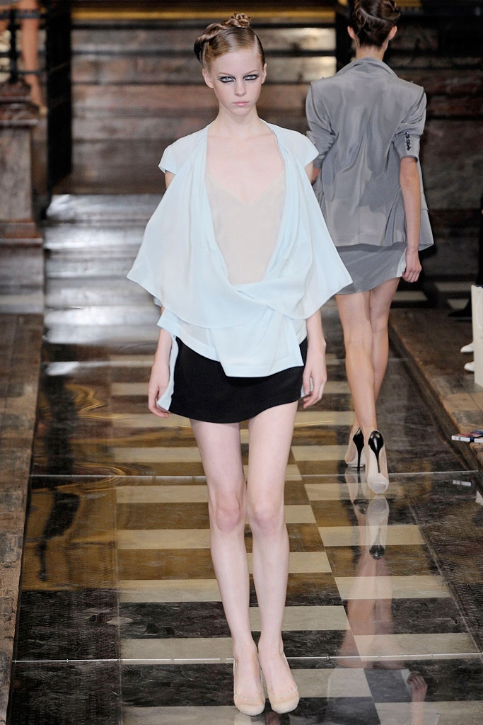 light blue draped top with black pencil skirt