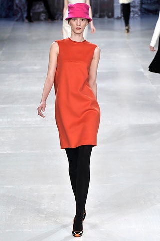 orange sleeveless dress with pink hat