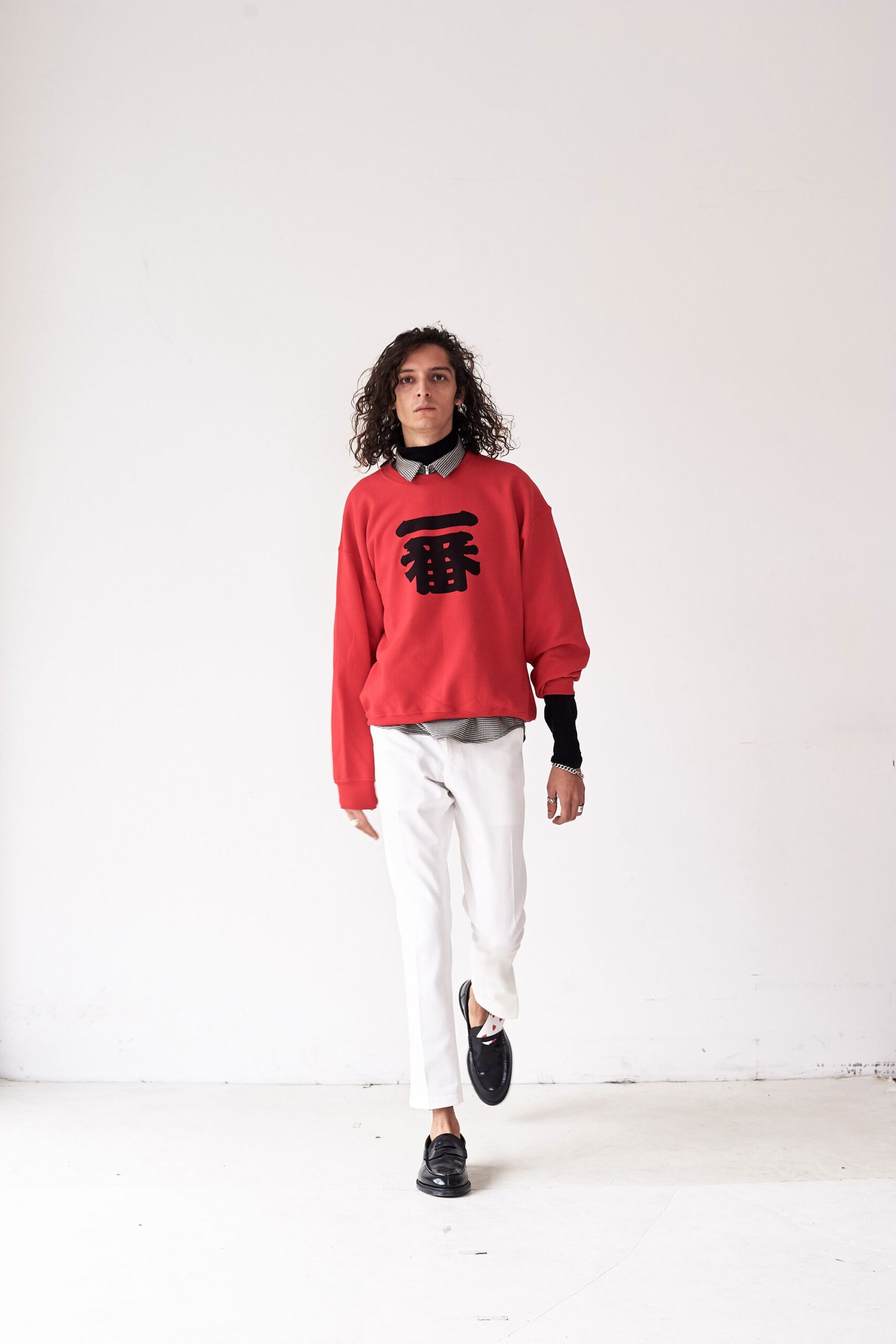 red relaxed sweater with white pants