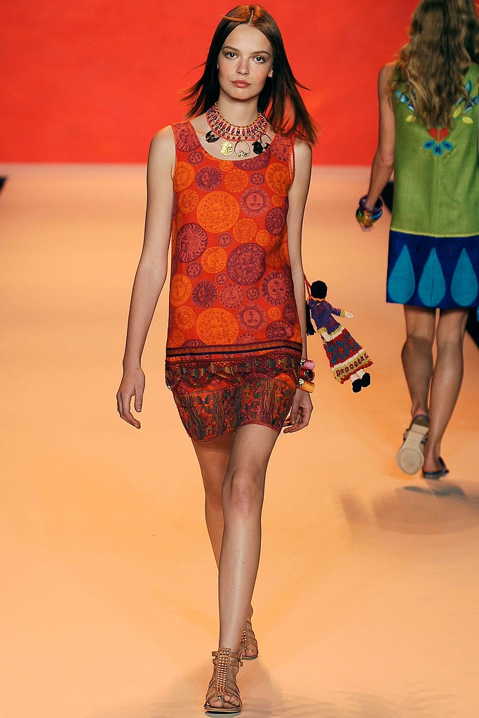 red orange printed top and mini skirt