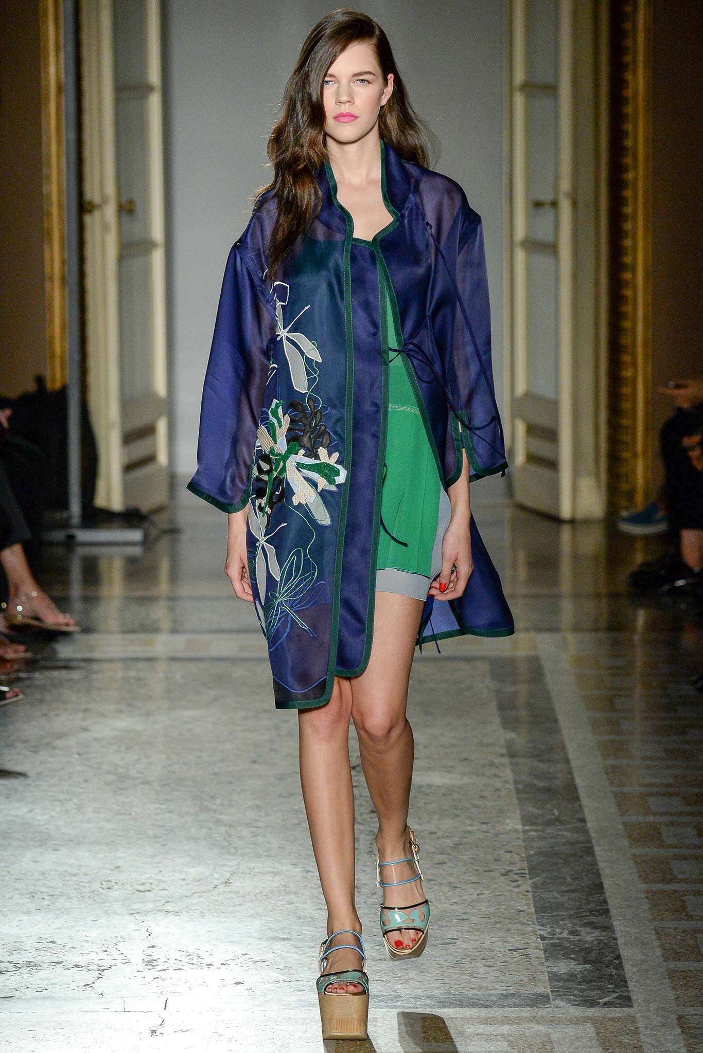 green fitted dress with blue coat