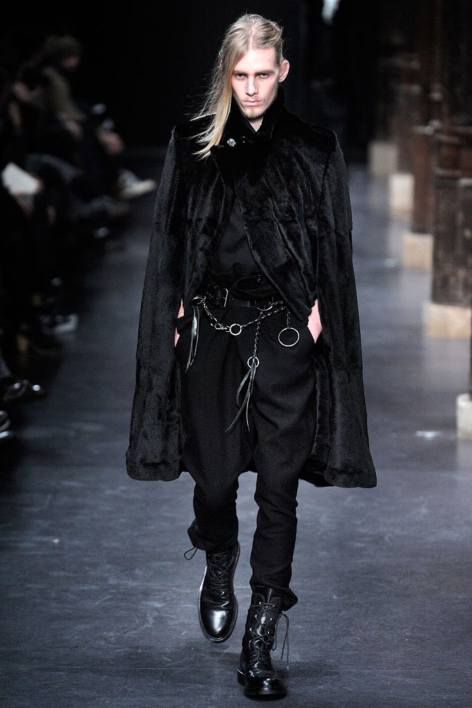 black faux-fur cape with relaxed pants