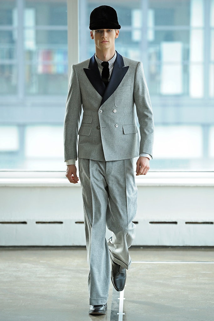 gray tailored suit with black hat
