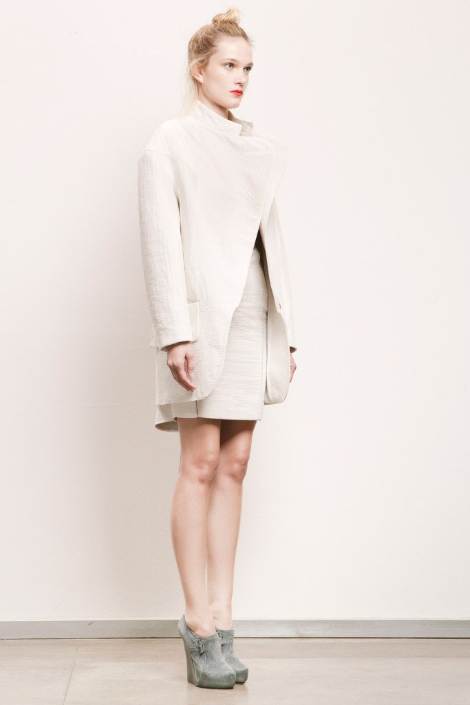 white relaxed coat with beige mini dress