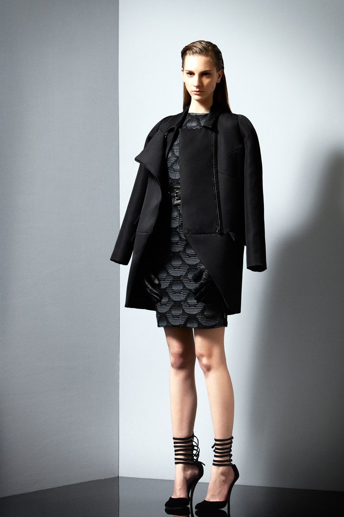 black coat and fitted dress