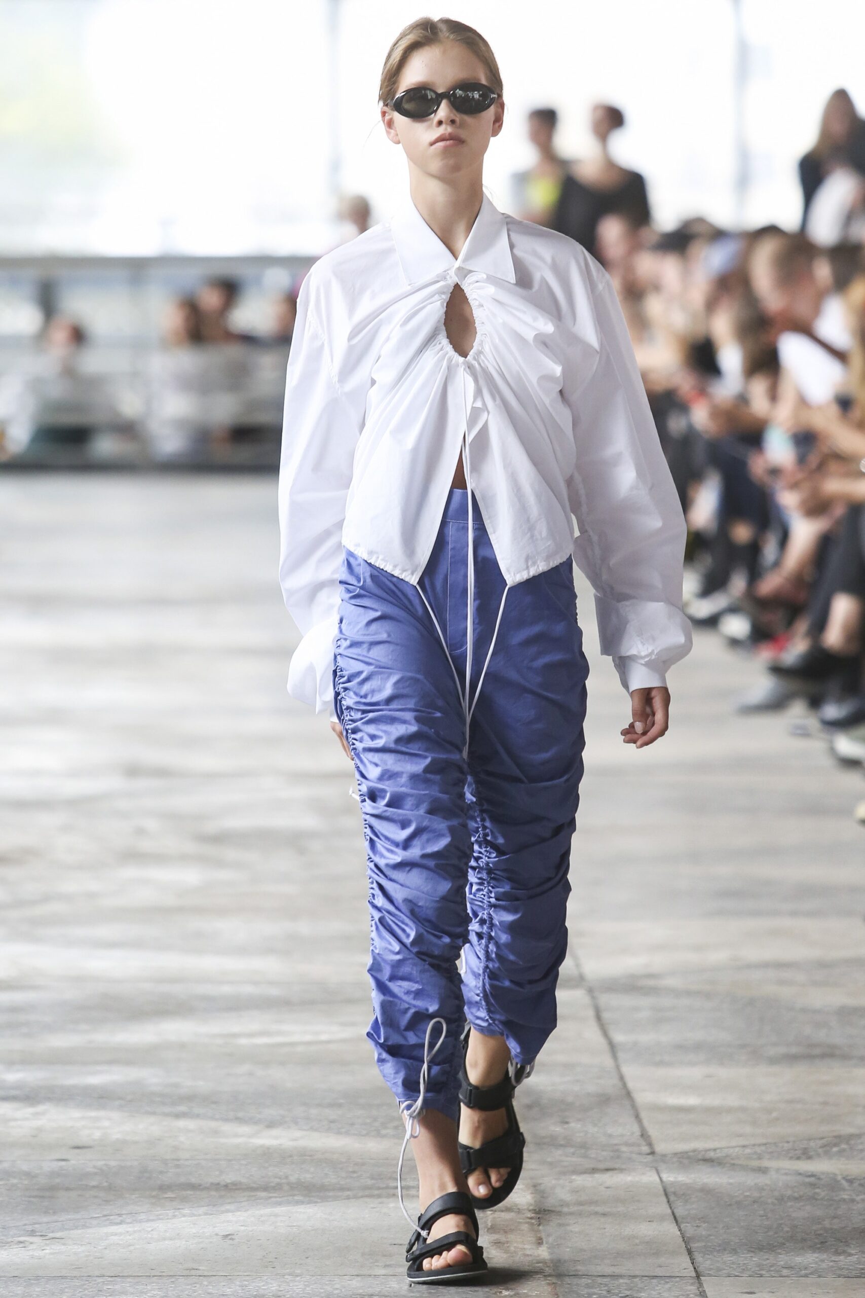 white relaxed shirt with blue ruched pants