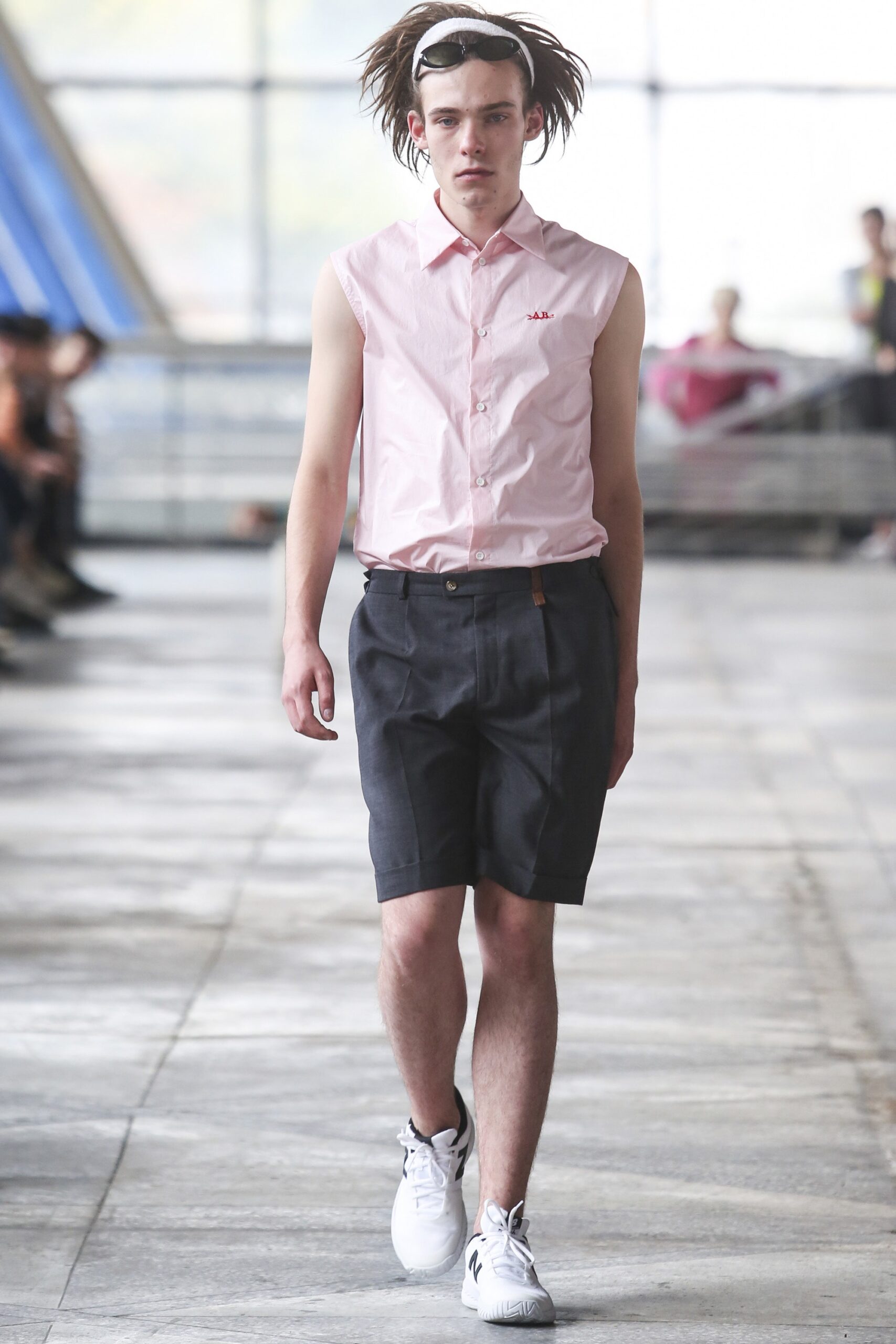 pink fitted sleeveless shirt with gray shorts
