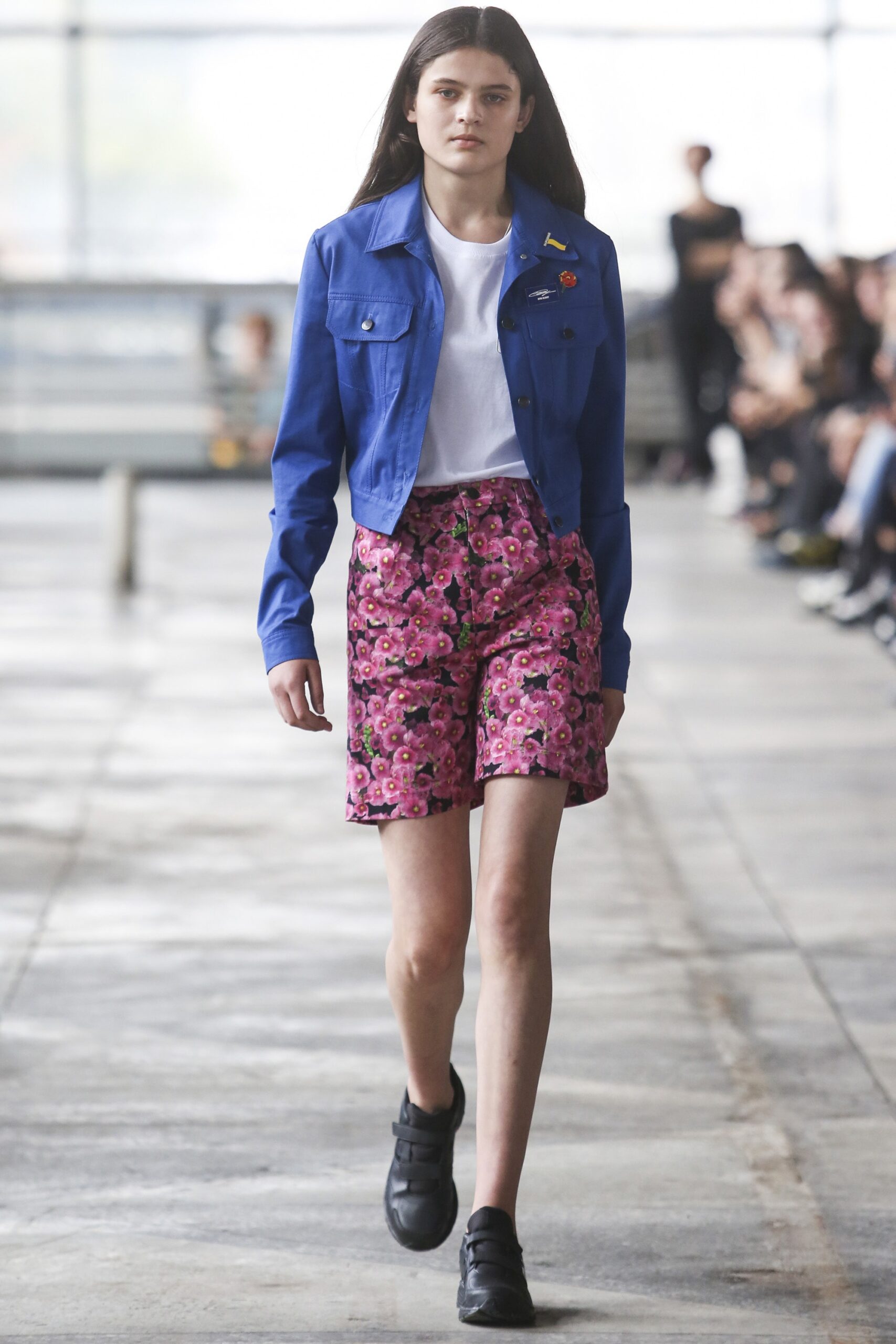blue jacket white t-shirt pink floral shorts