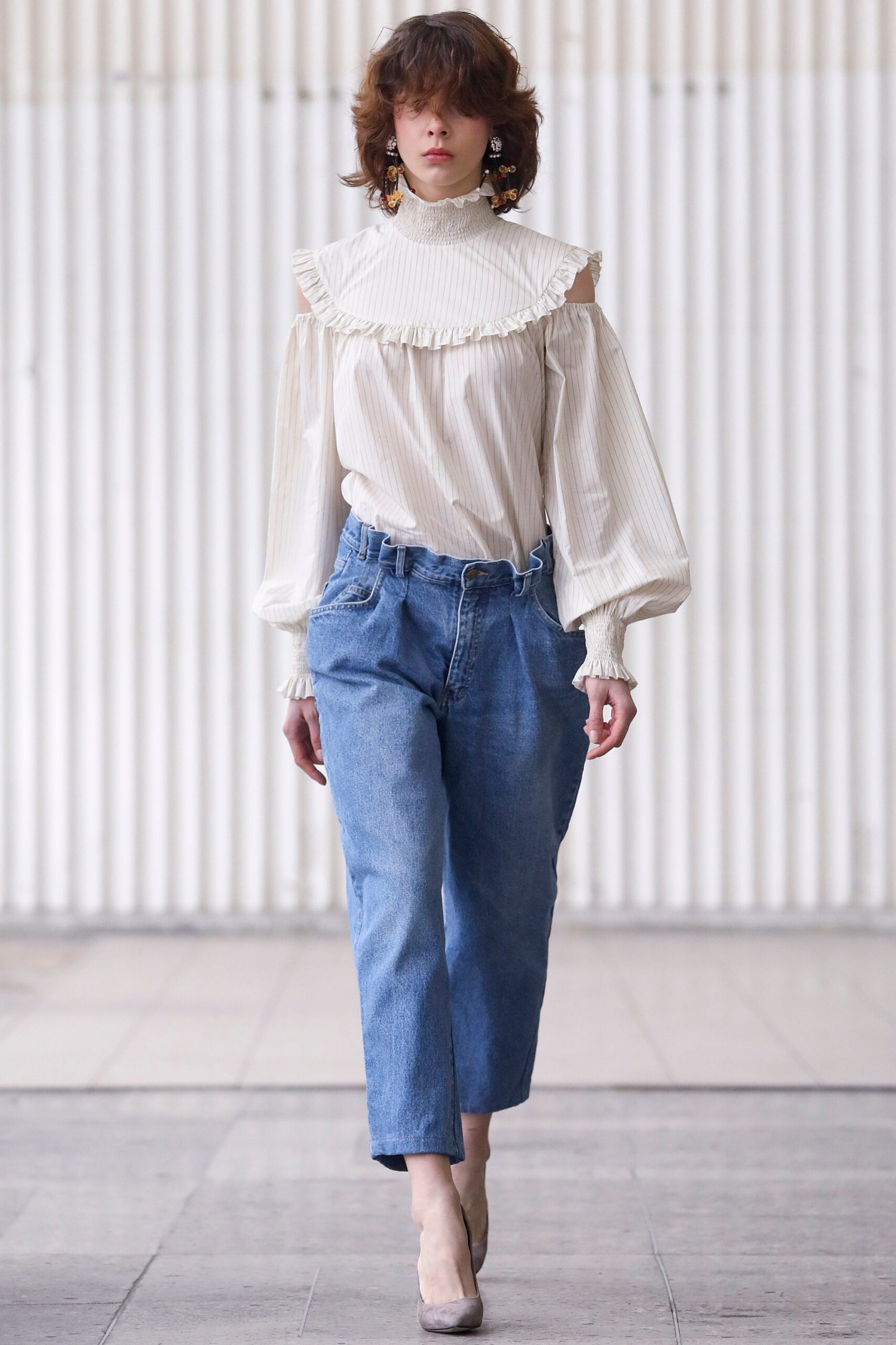 white ruffled blouse with denim pants