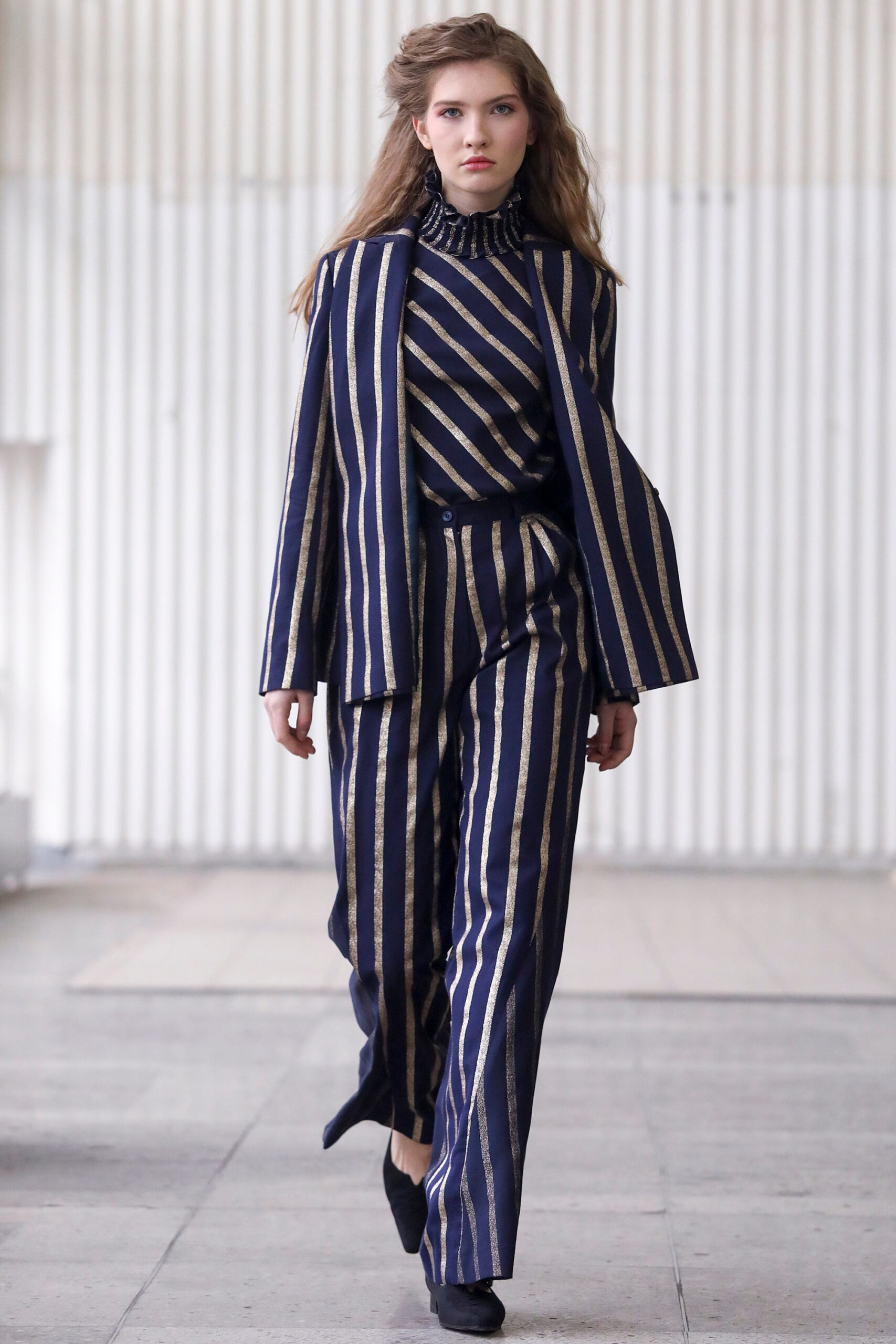 blue and gold striped suit