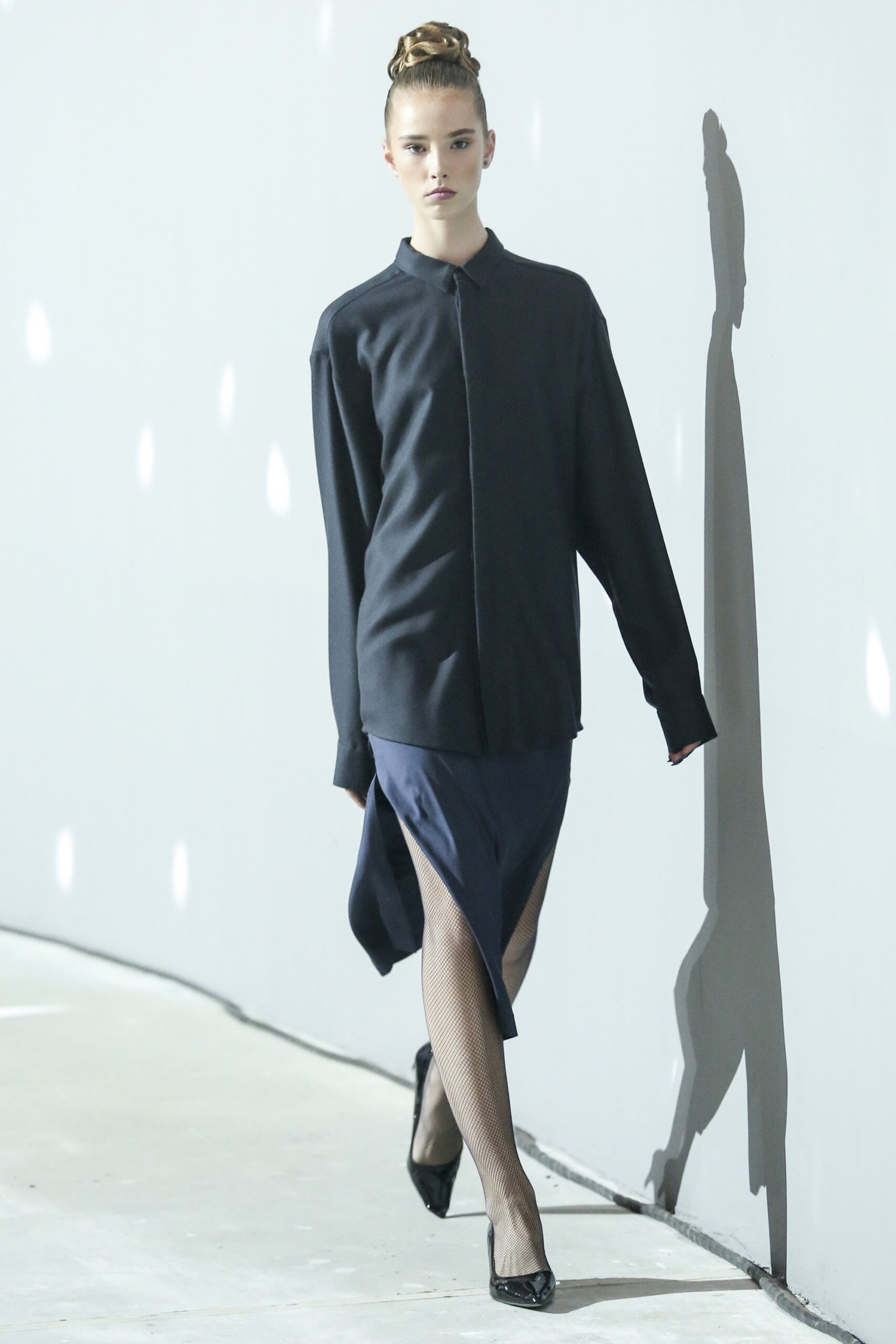 oversized black shirt with navy skirt