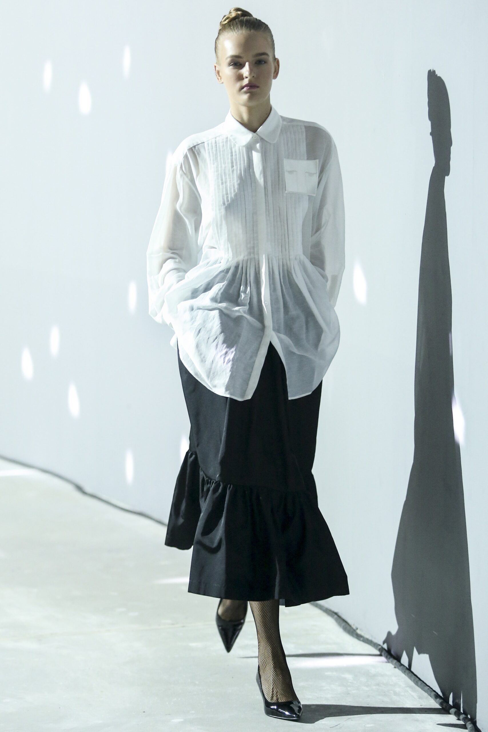 white relaxed shirt black tiered skirt