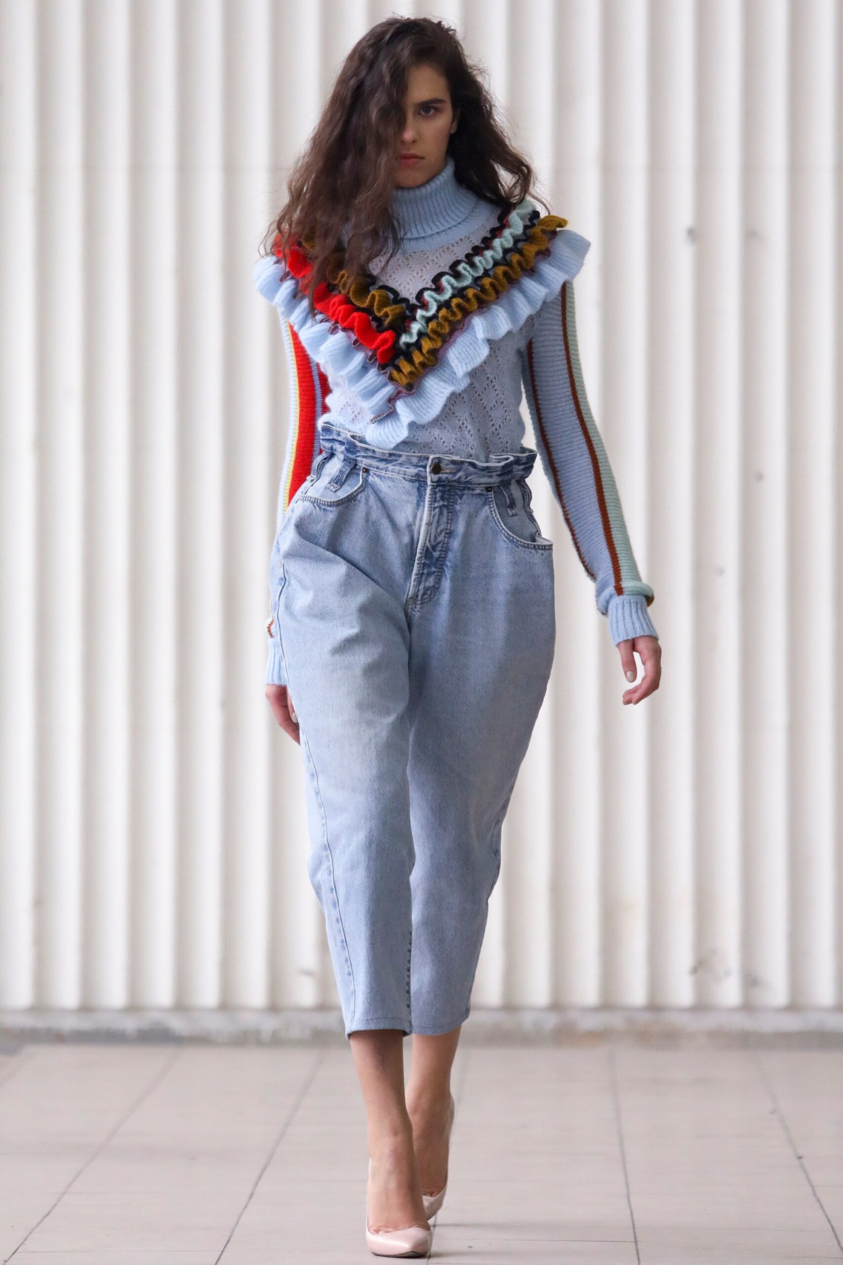 blue ruffled sweater with relaxed jeans