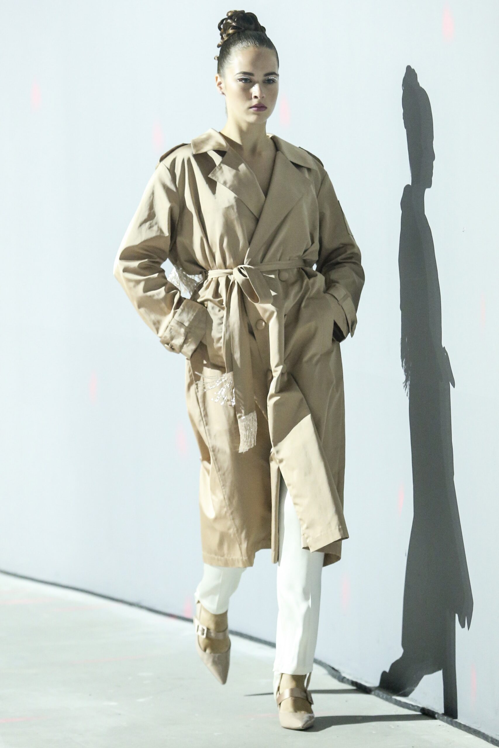 beige trench coat with white pants