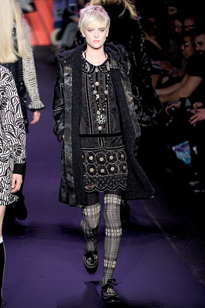 black wool coat with embroidered blouse