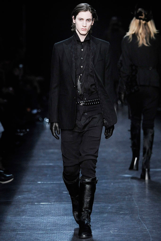 black tailored suit with gloves and boots