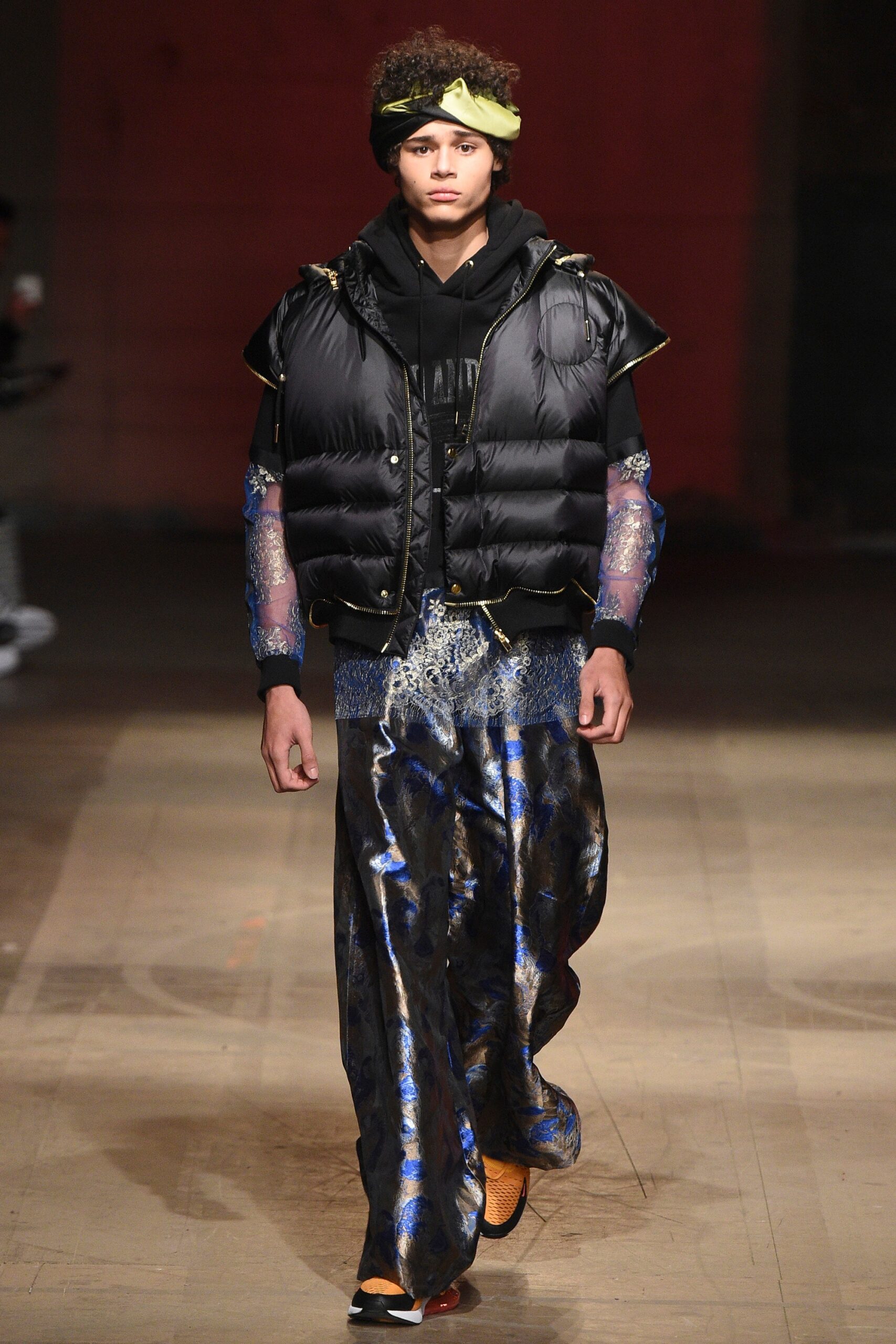 black jacket and blue flared pants