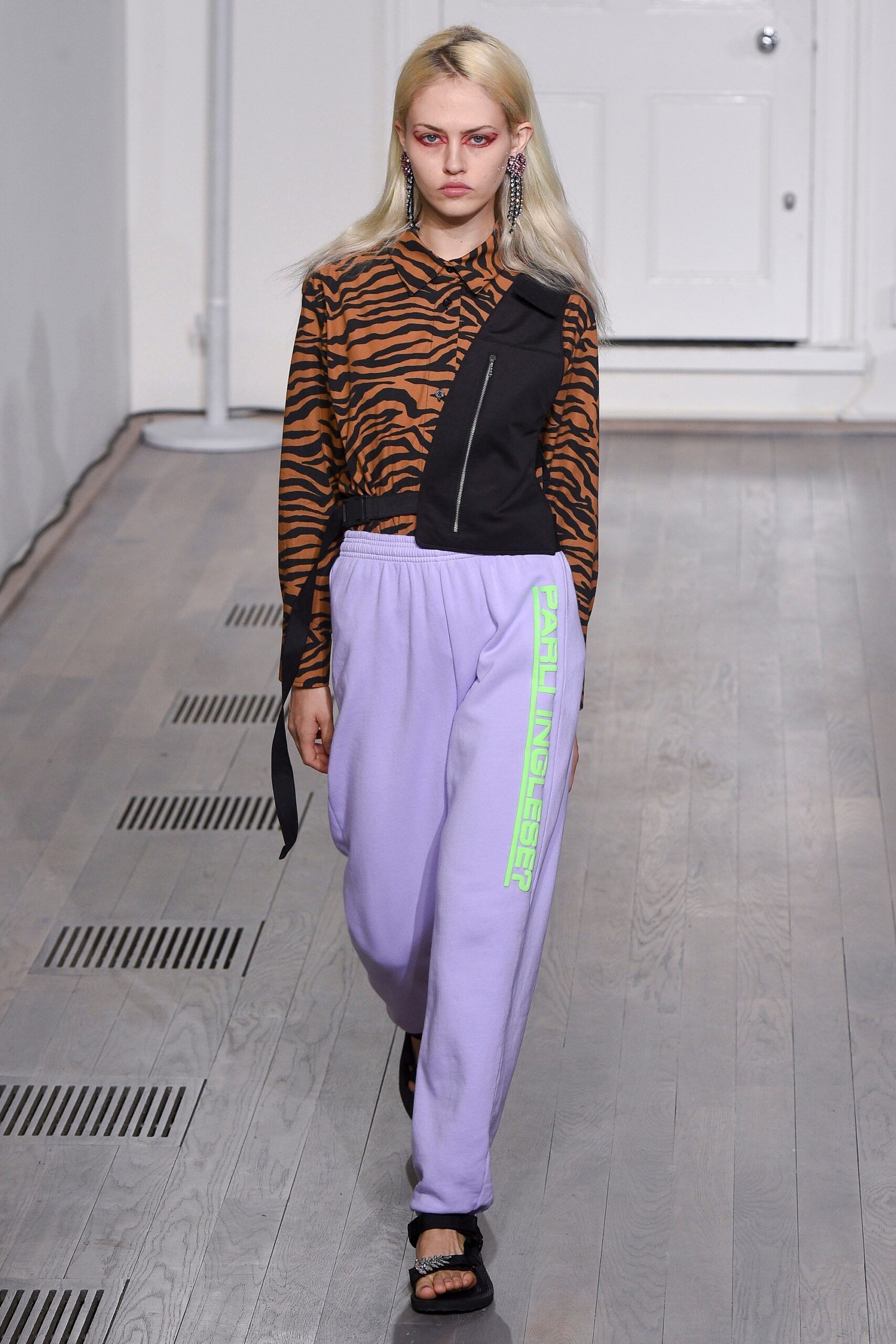 brown animal-print shirt and purple pants