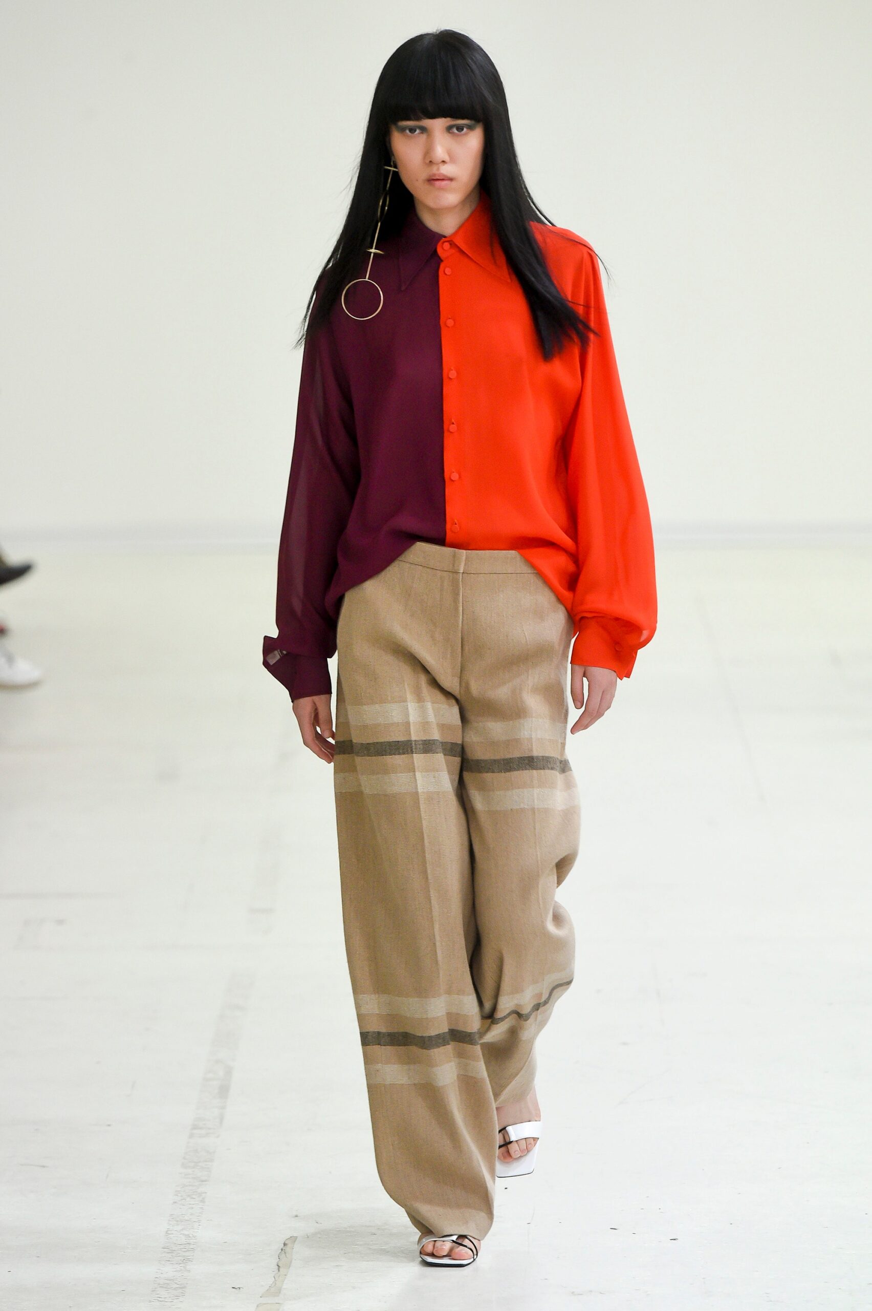 red and purple relaxed shirt with beige wide-leg pants