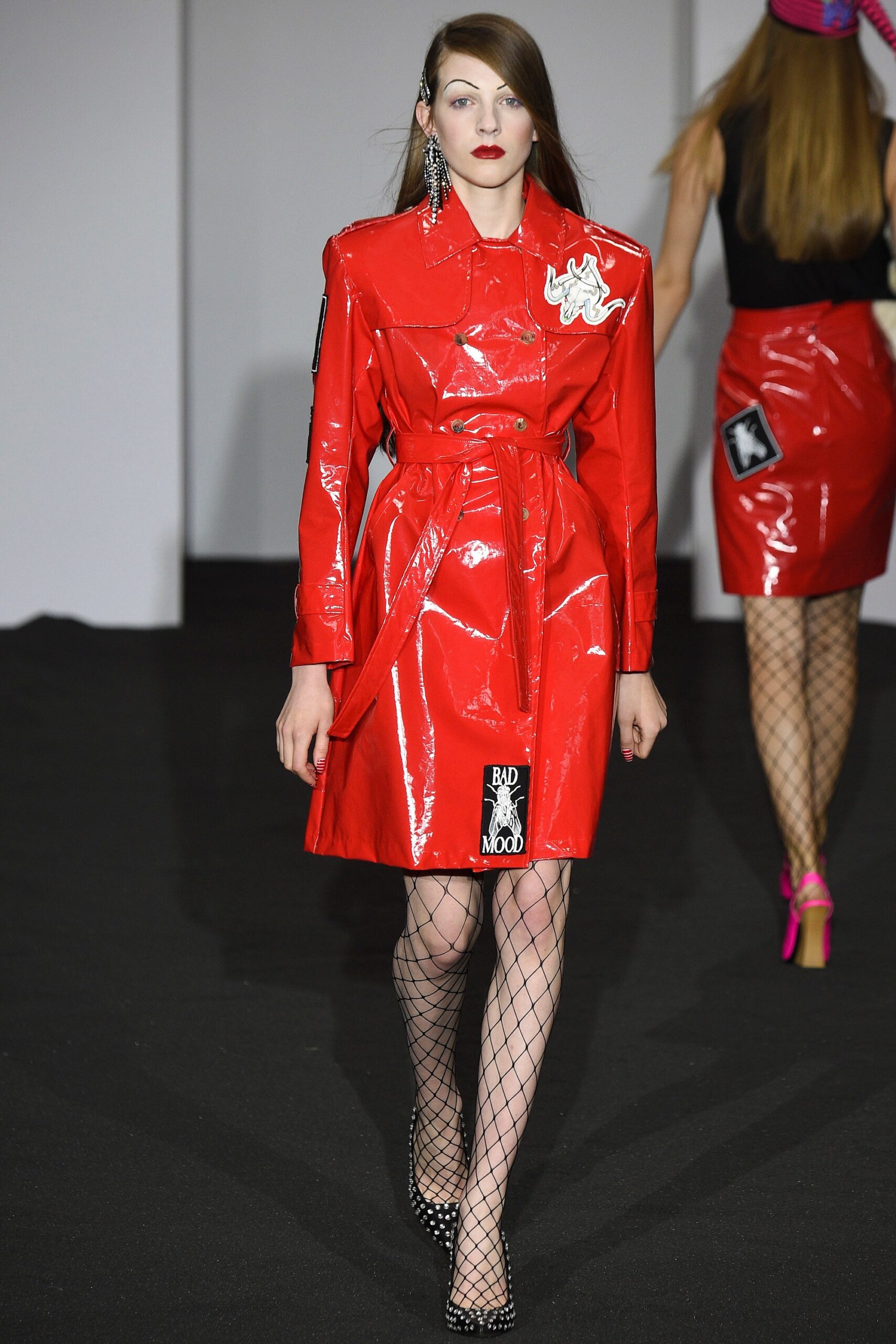 red vinyl trench coat and skirt