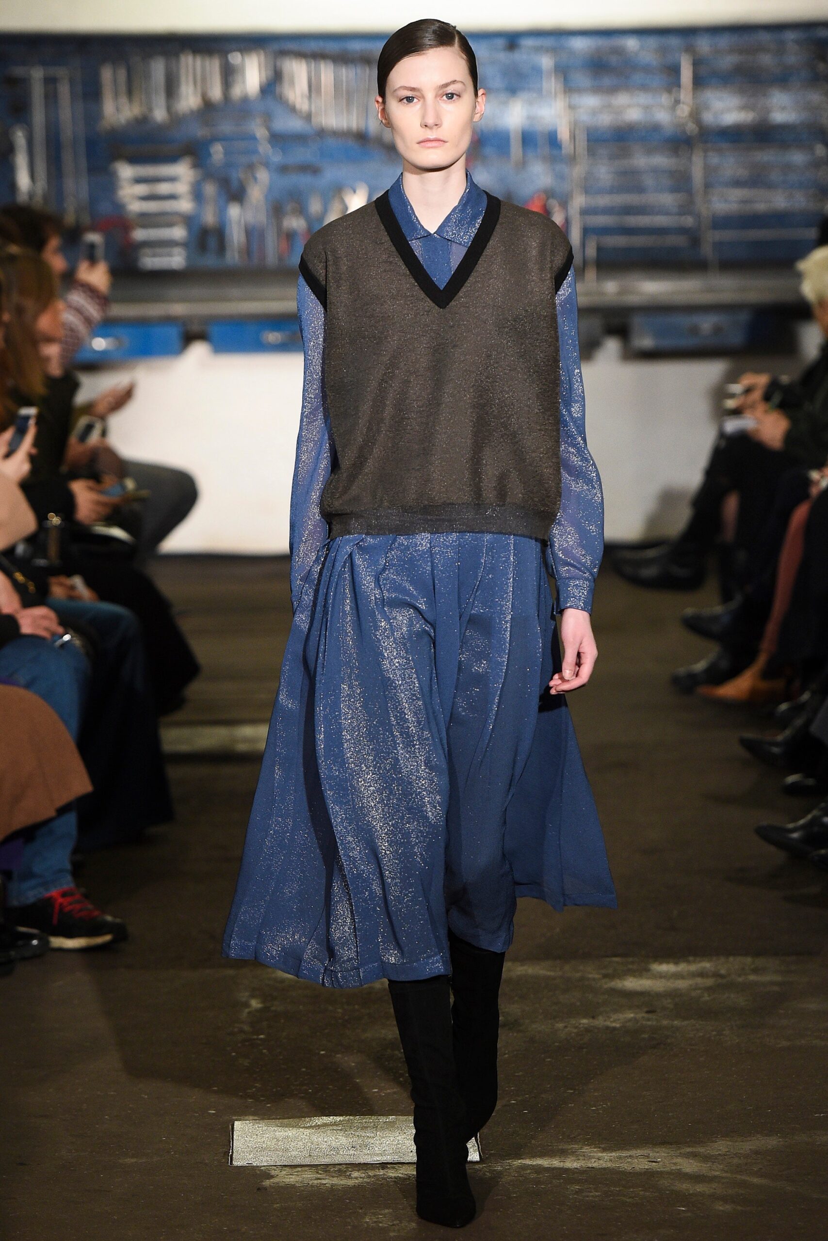 black silk top with blue pleated skirt