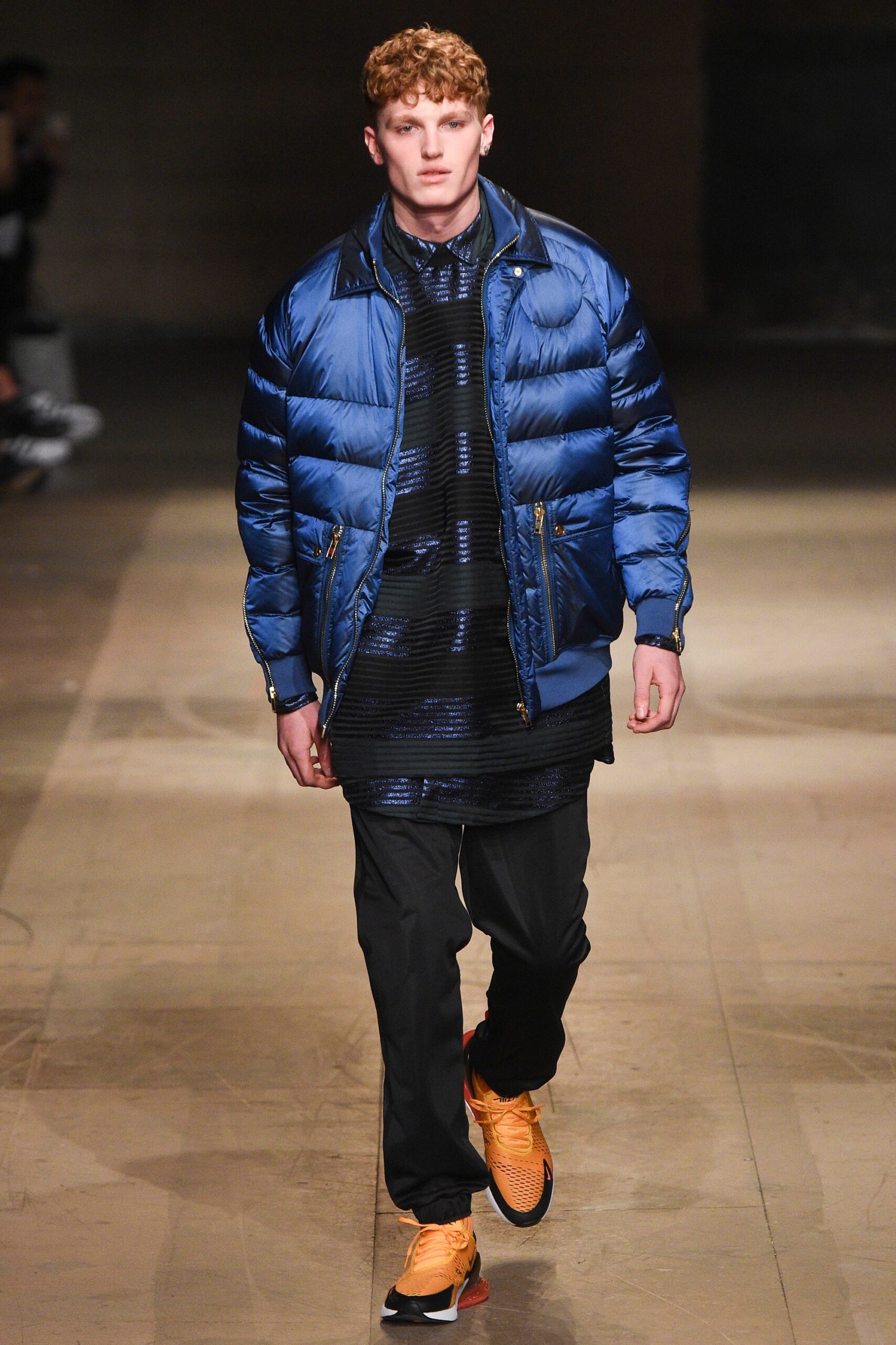 blue puffer jacket with black shirt