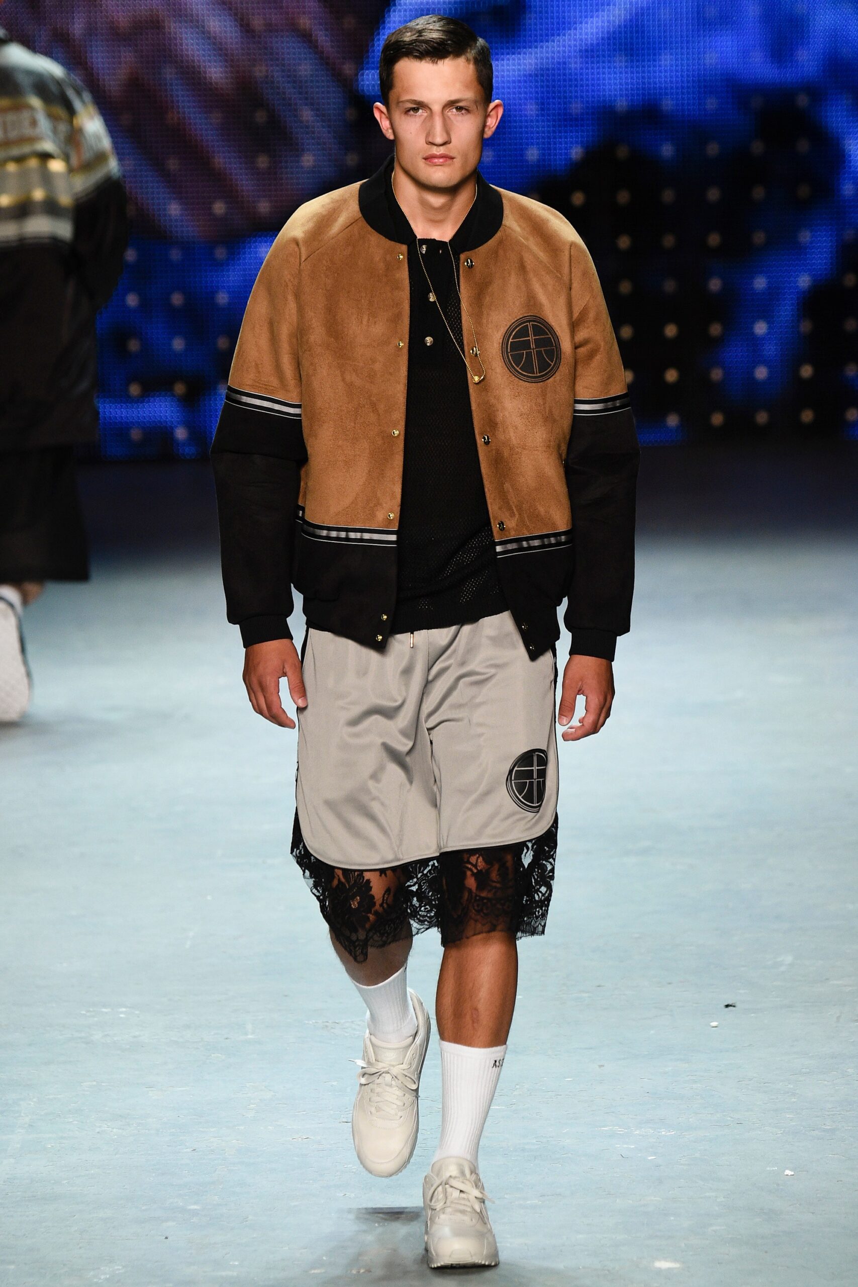 brown suede relaxed jacket with gray shorts