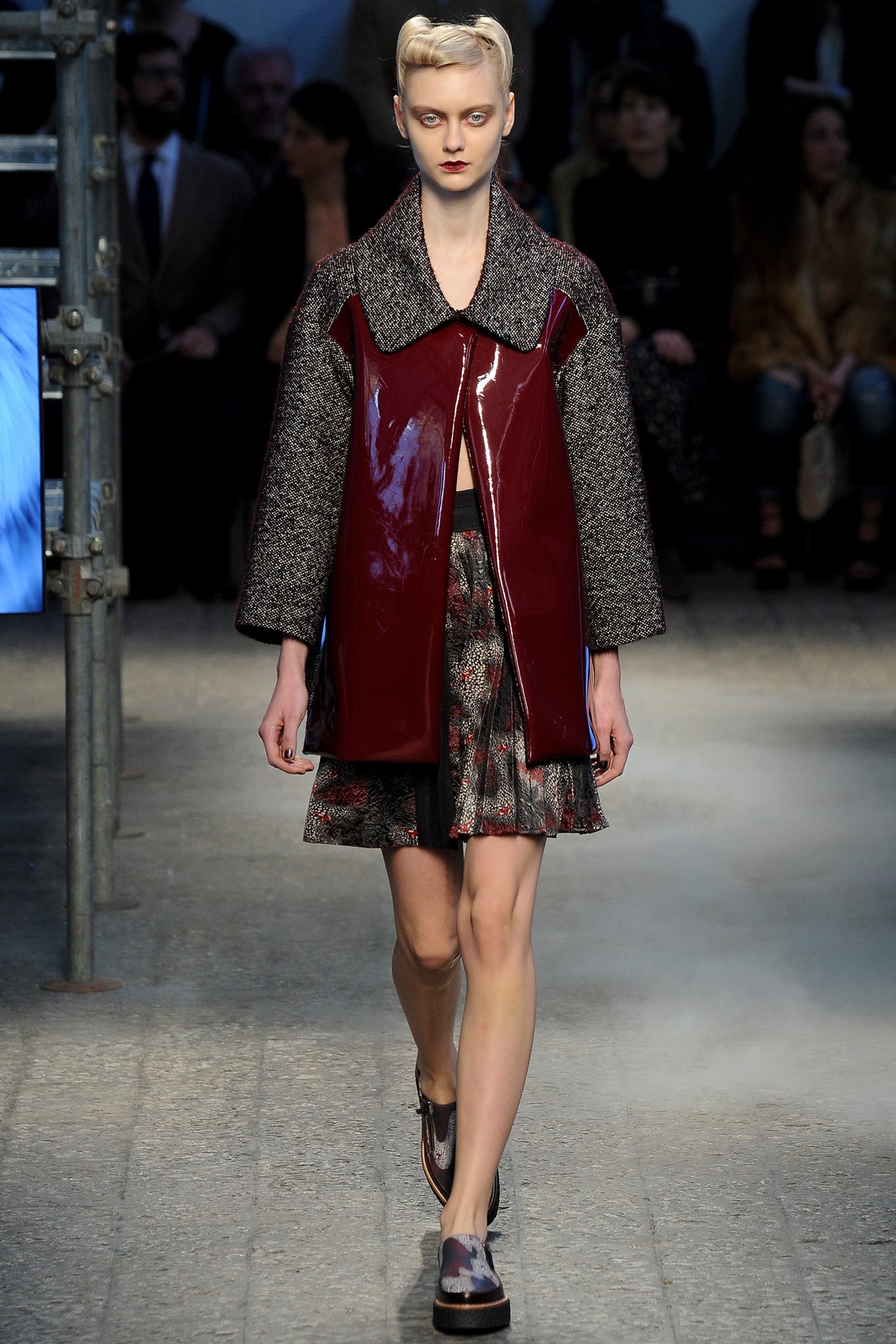 red leather coat with pleated skirt