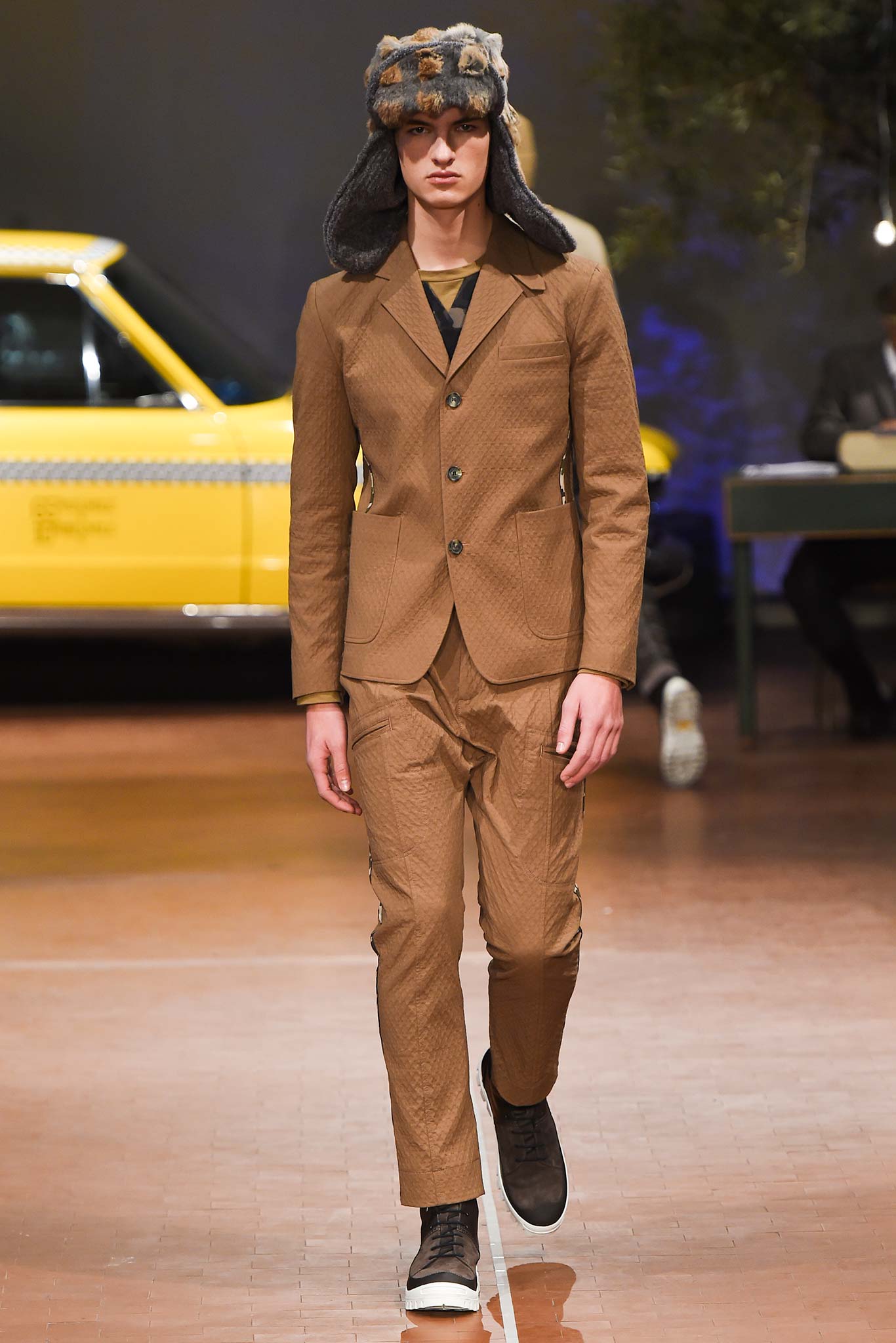brown tailored suit with hat