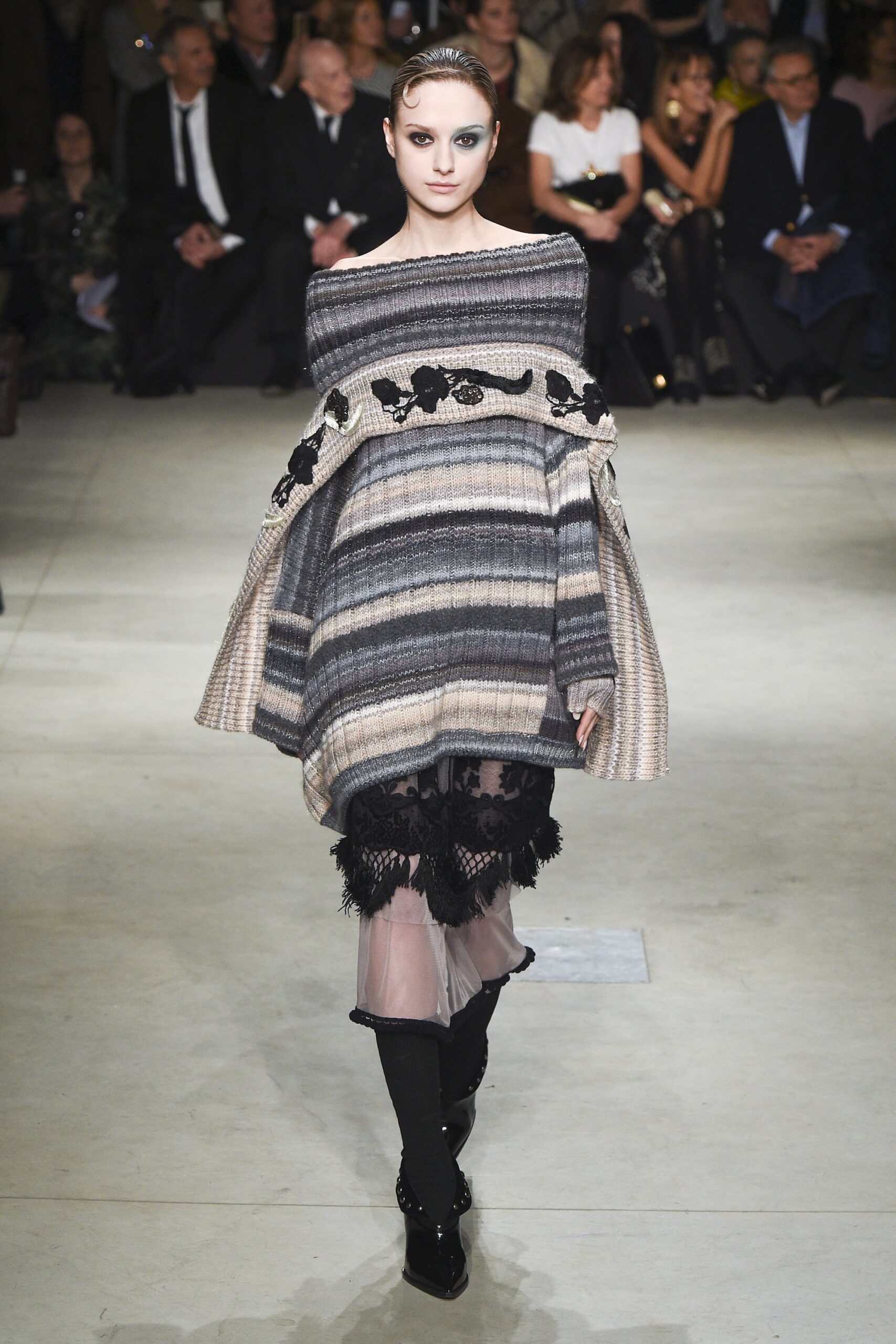 oversized gray poncho with black mini skirt