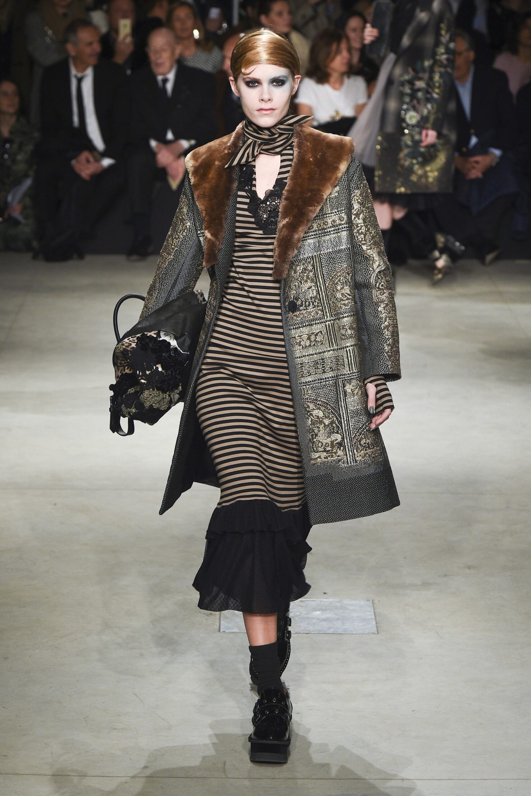 embroidered black coat and striped dress