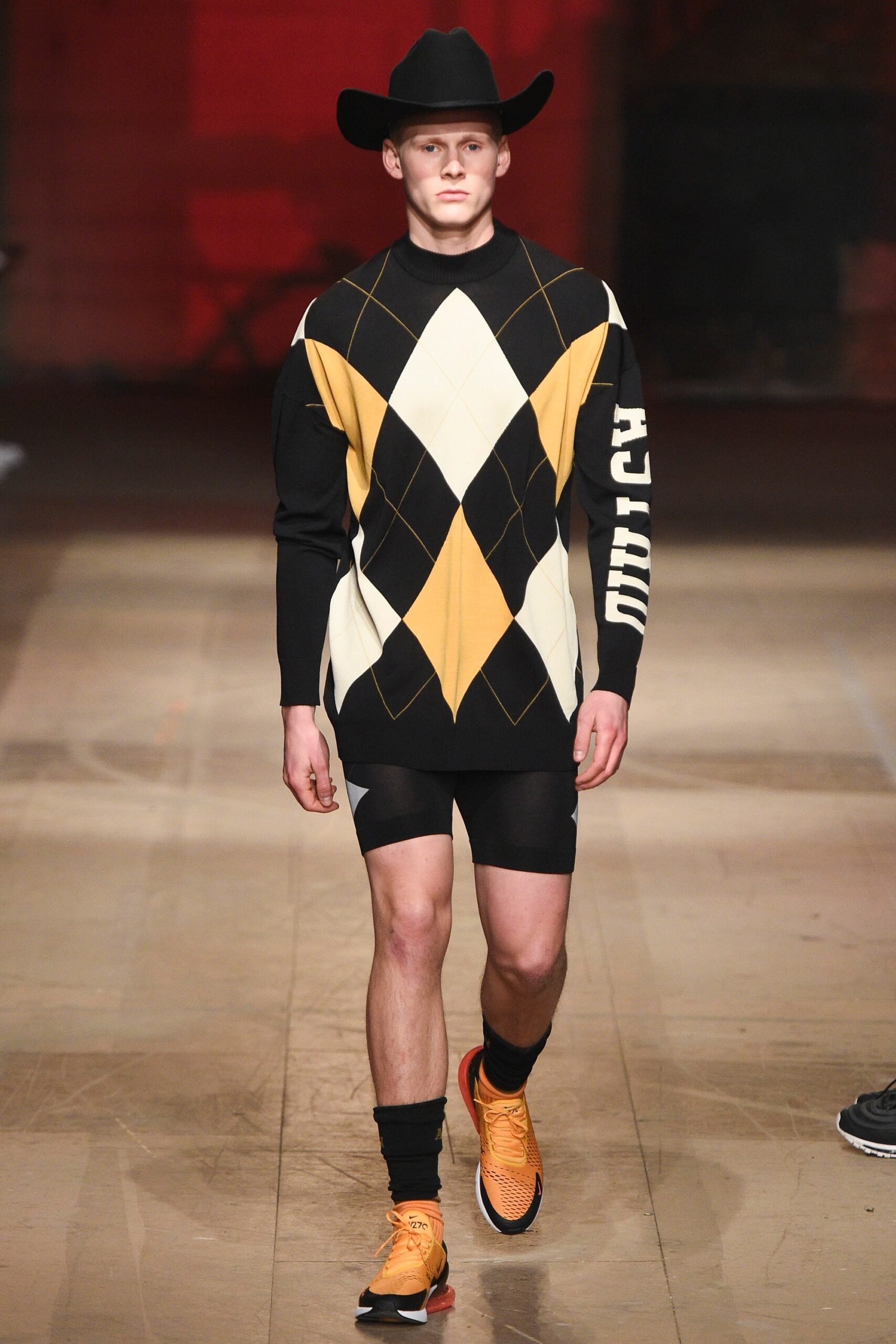 fitted black and yellow argyle sweater