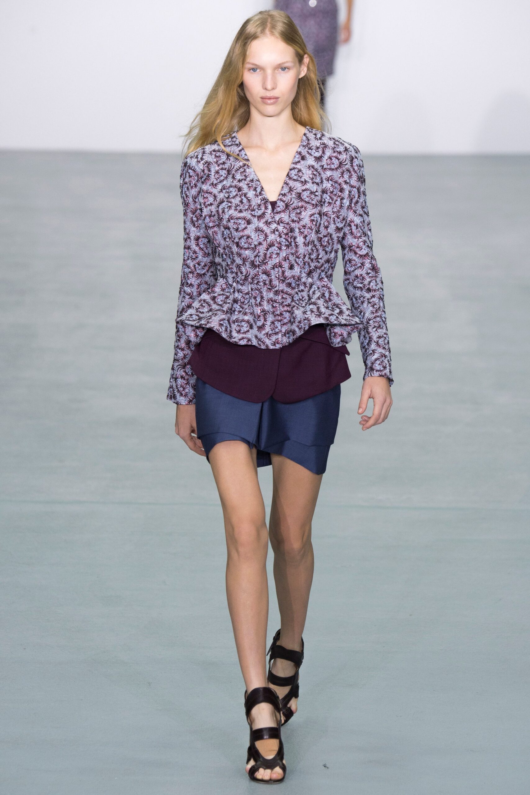 fitted purple blouse and blue skirt