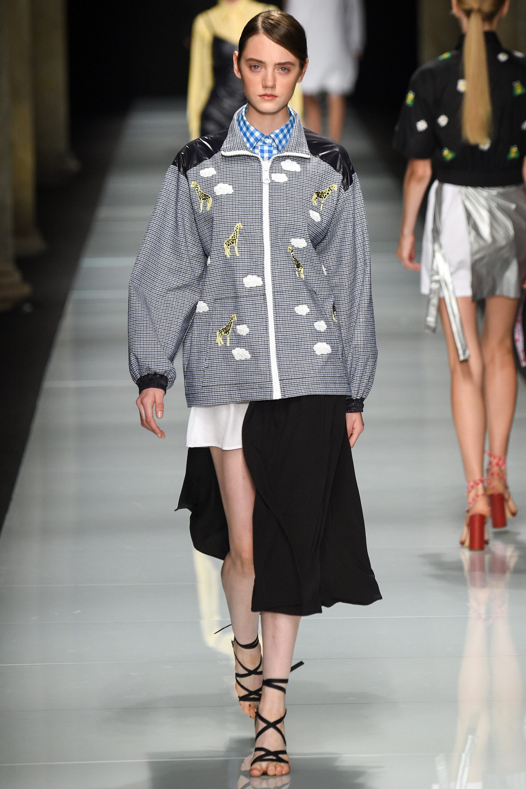 blue embroidered jacket and black skirt