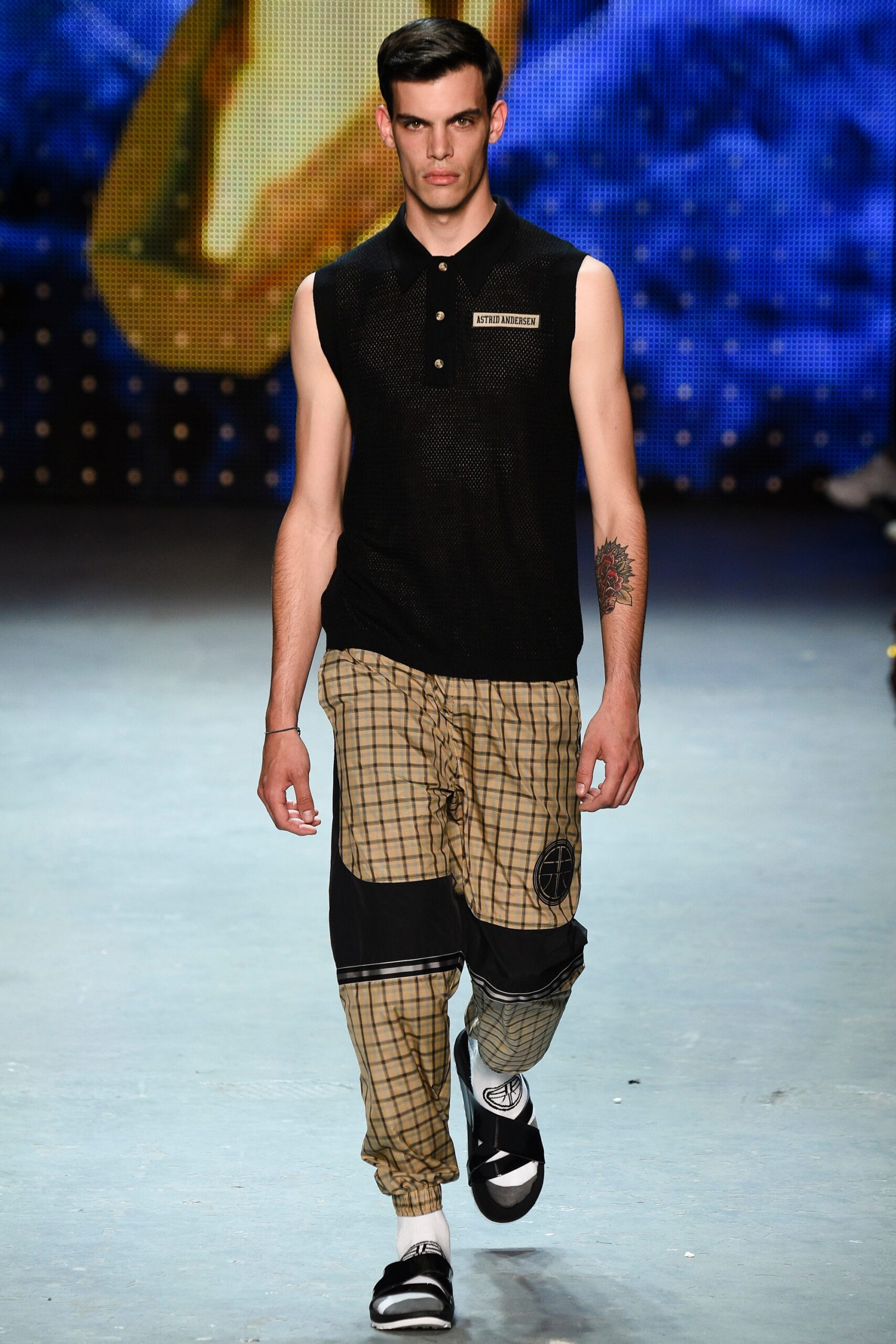 black sleeveless top with relaxed pants