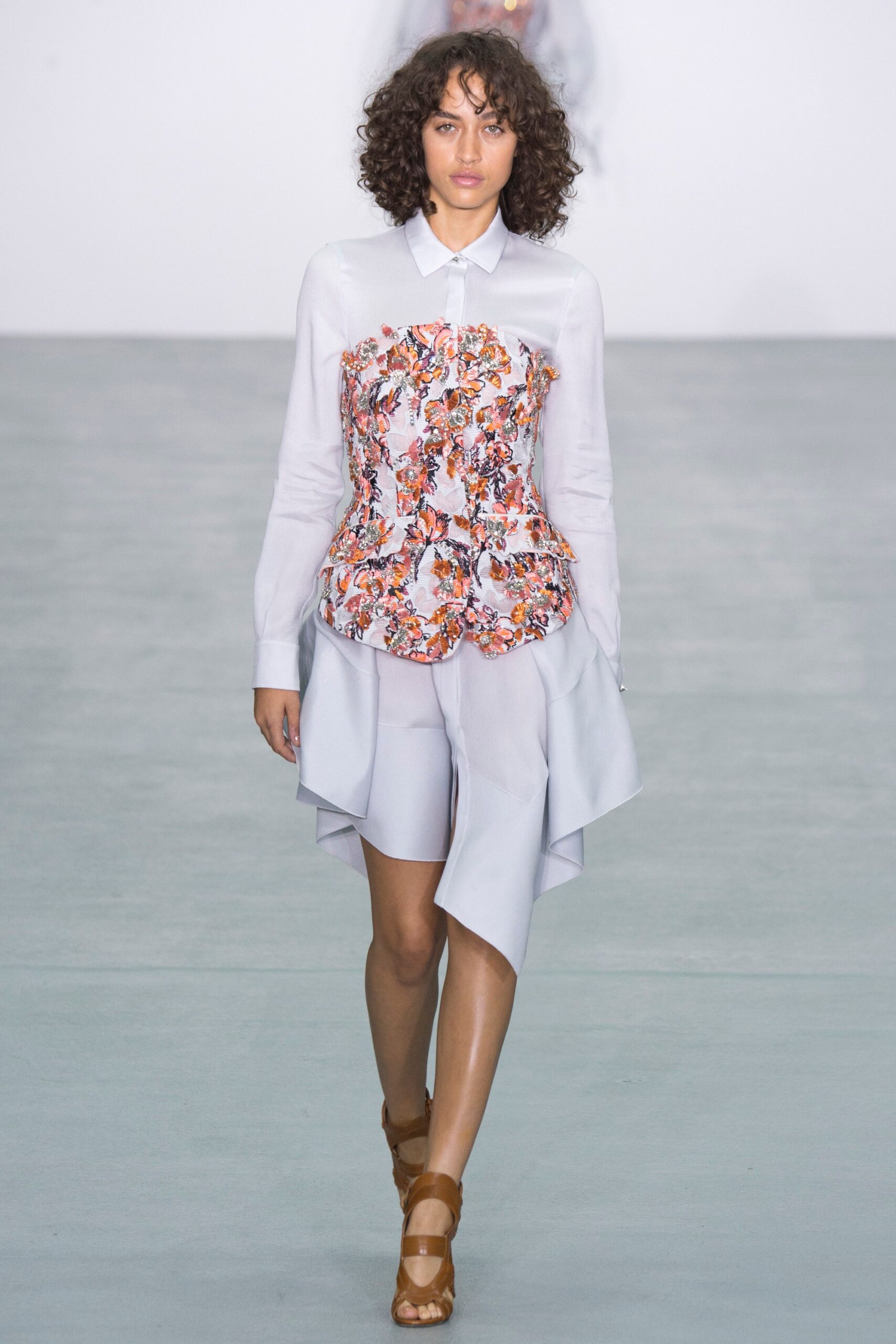 white embellished blouse with gray skirt
