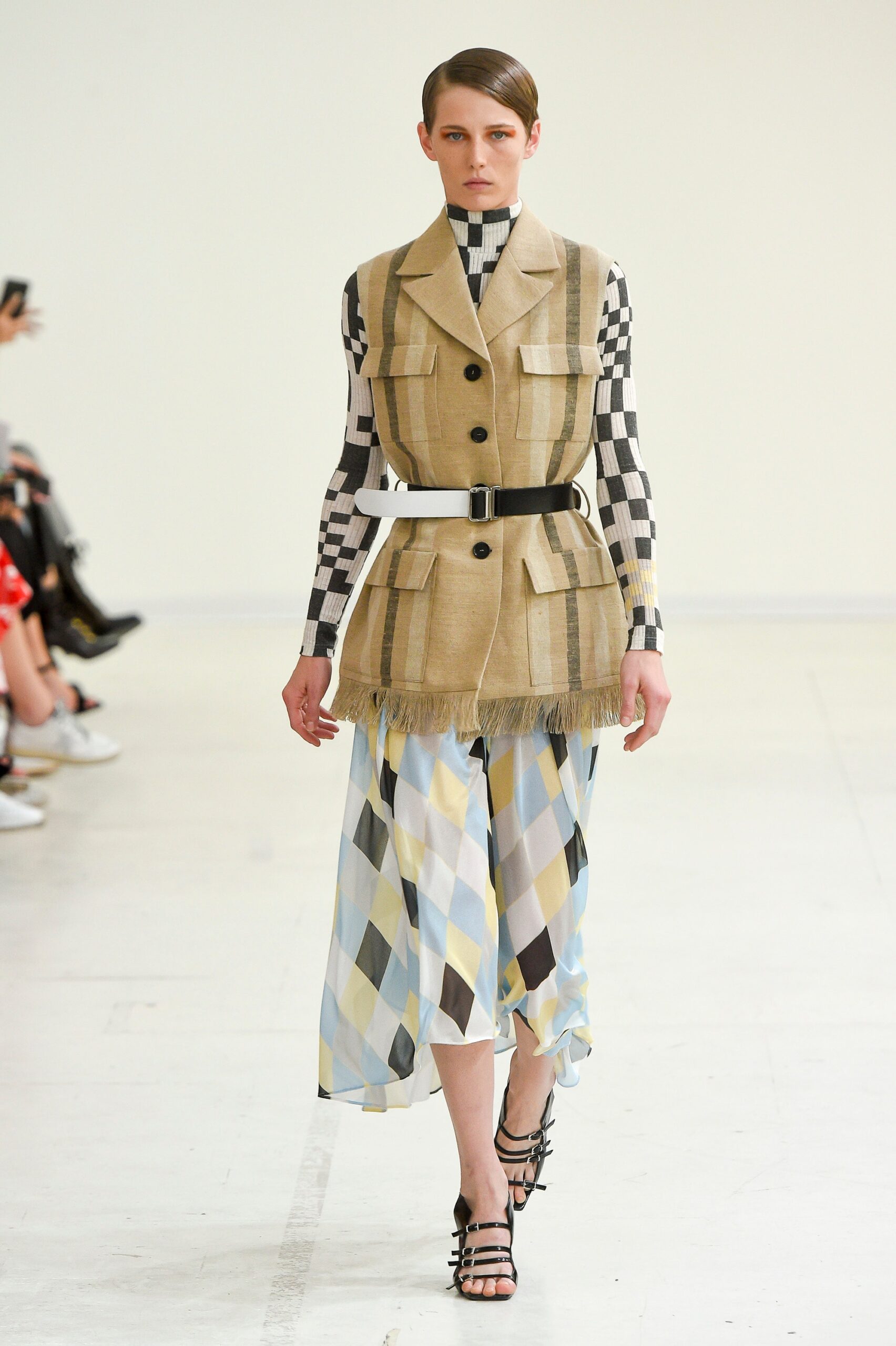 beige vest with checked top and tiered skirt
