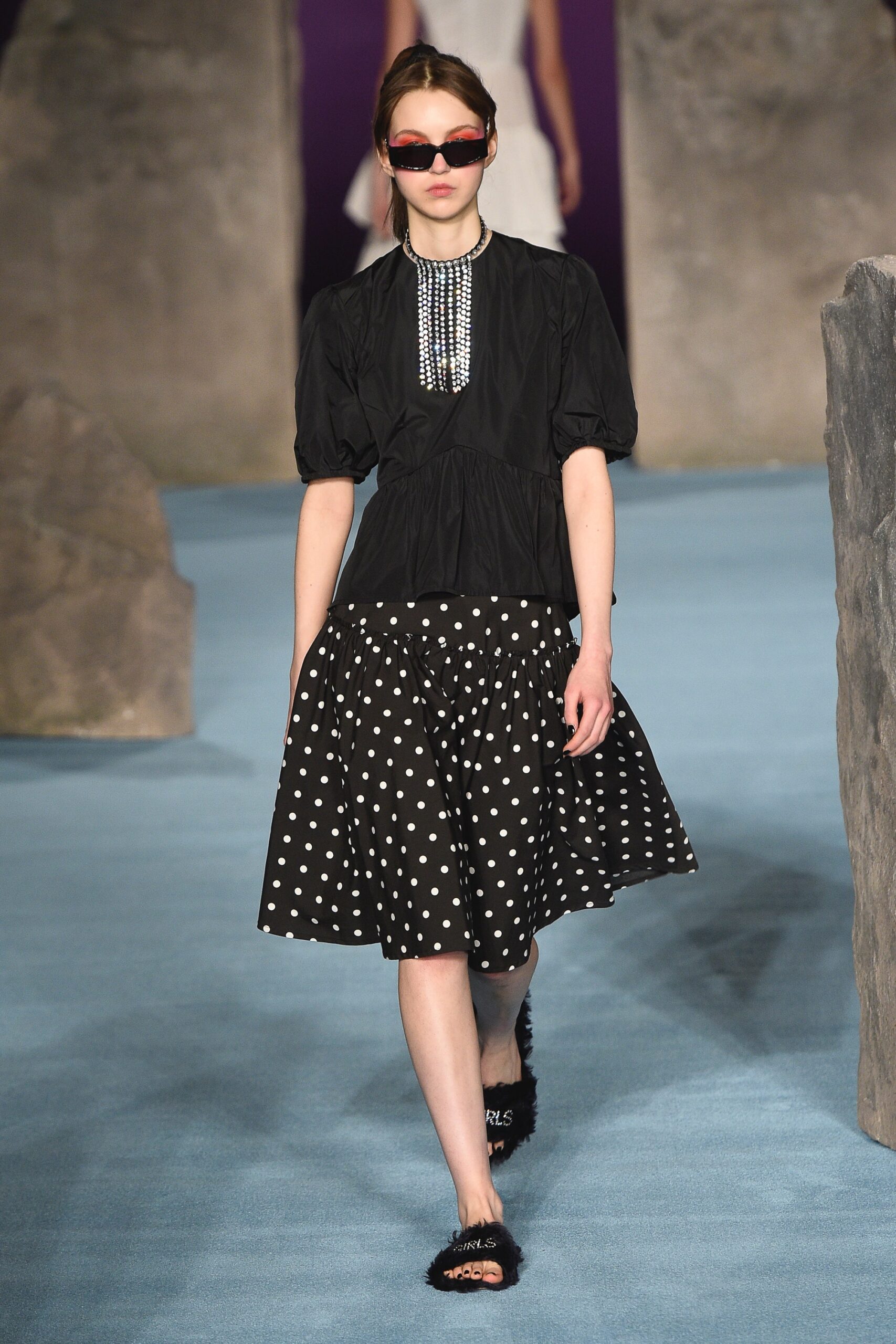 black blouse and polka-dot skirt