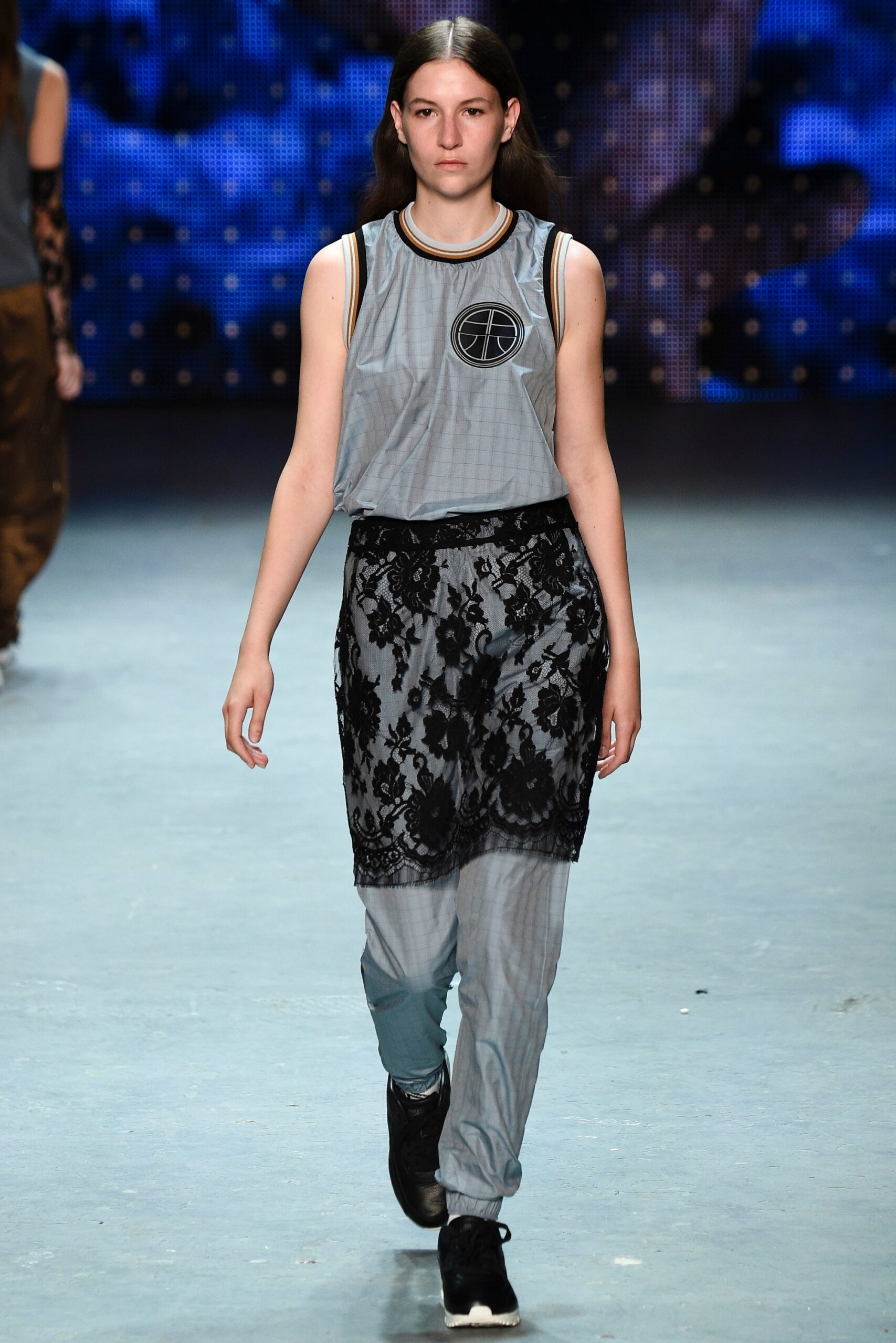 gray sleeveless top with black pants