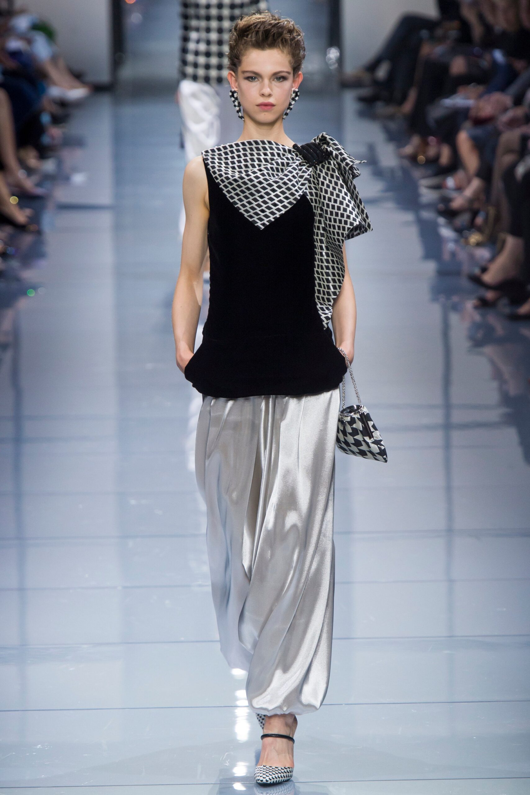 black and white asymmetric top with wide-leg pants