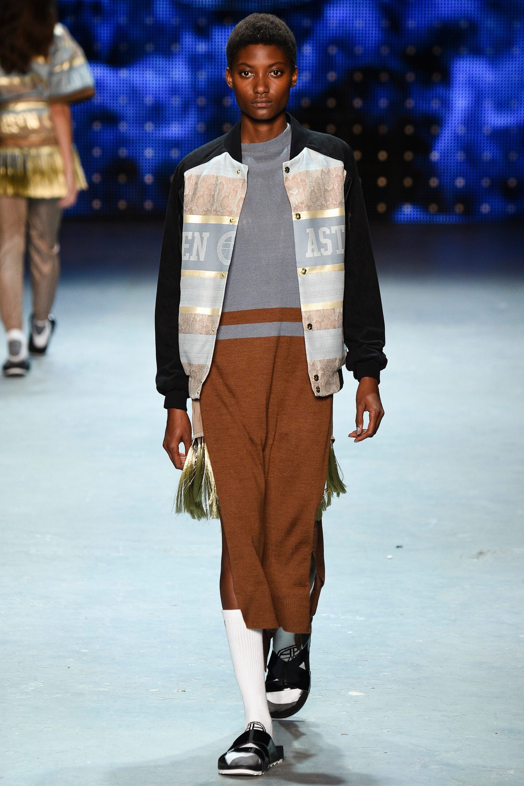gray jacket blue top brown skirt