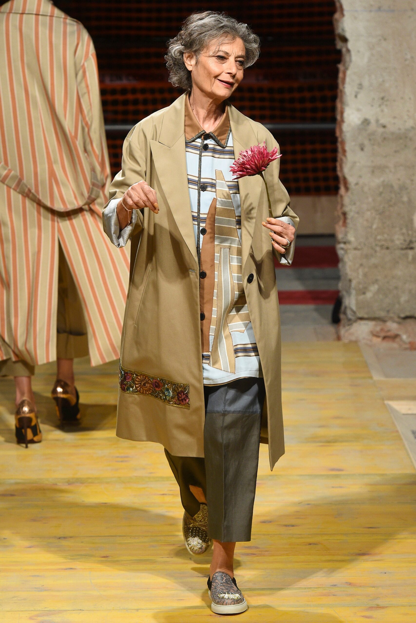 beige coat with printed shirt