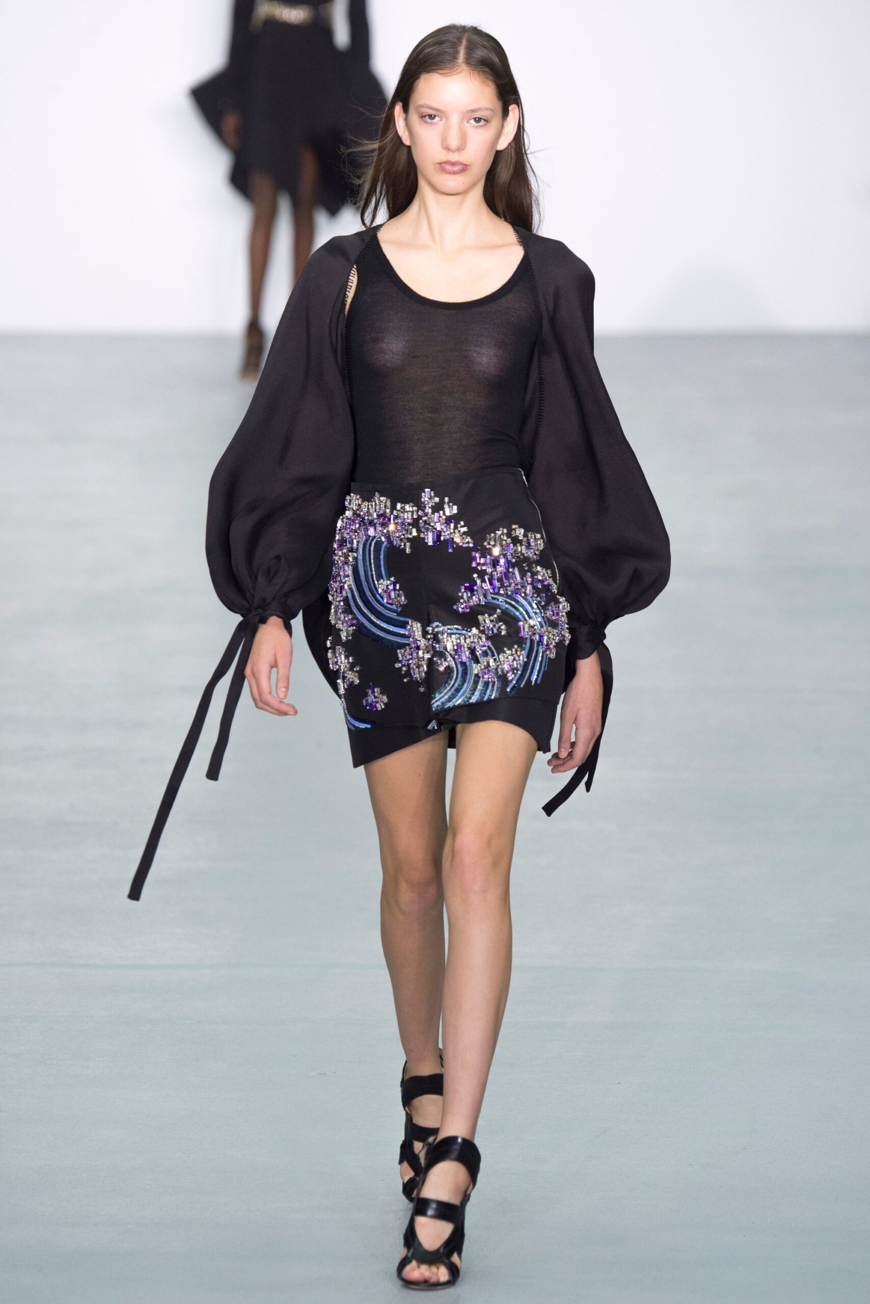 black fitted top and mini skirt