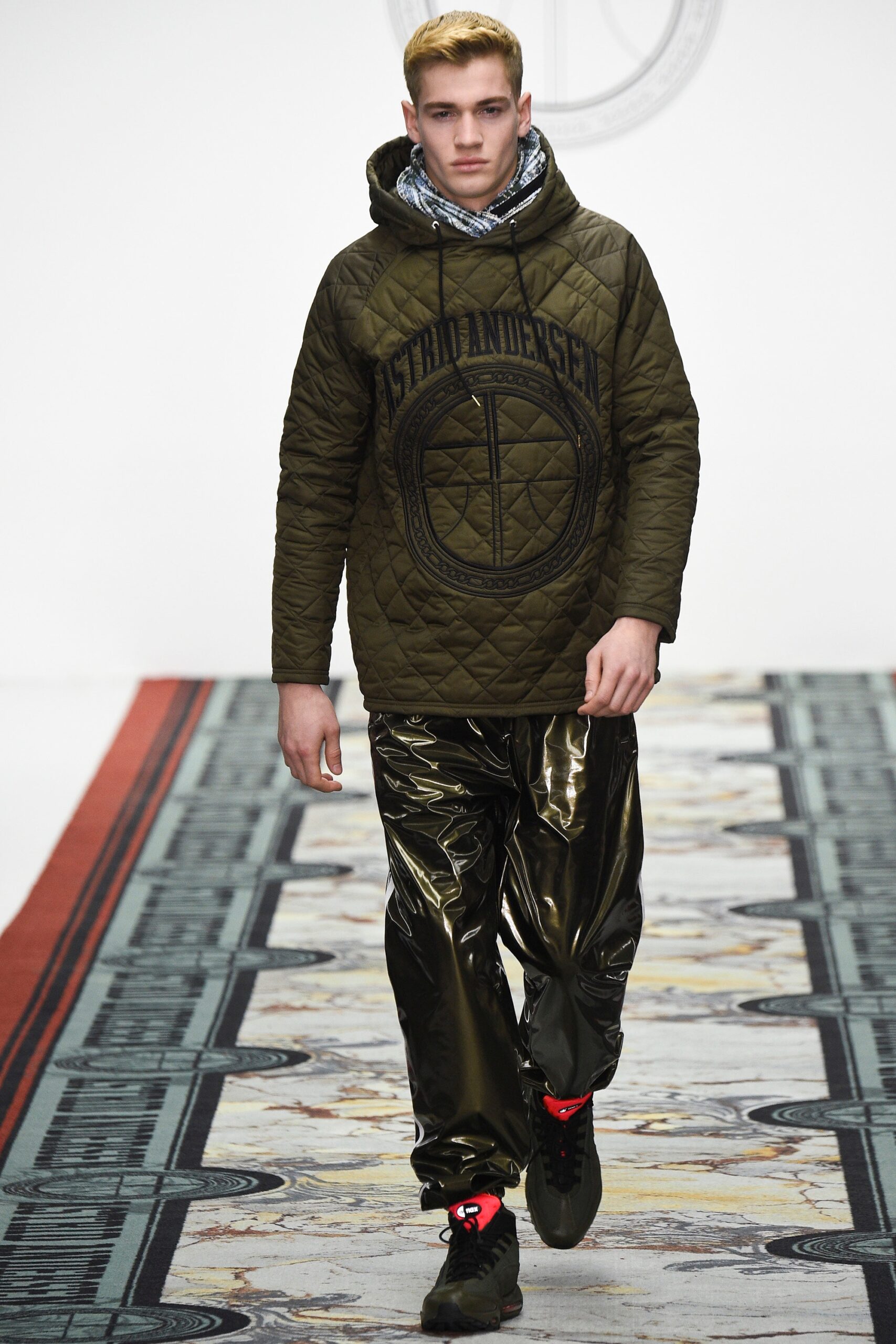 green quilted hoodie and black vinyl pants