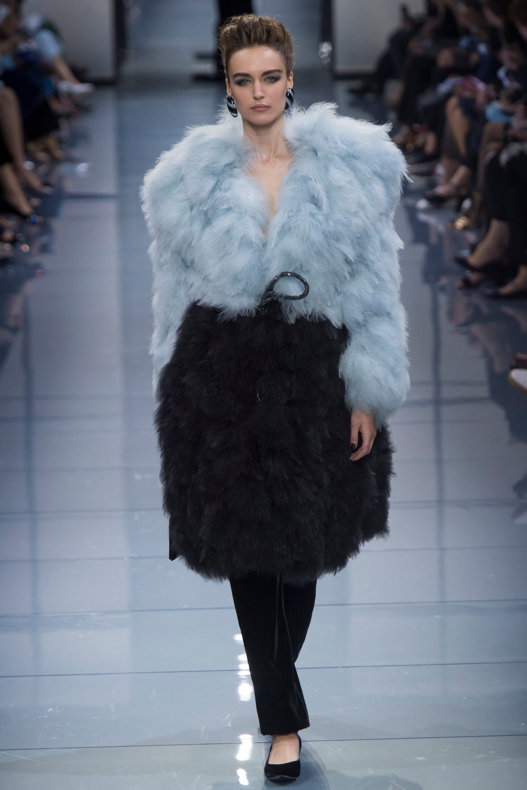 blue faux-fur coat with black pants
