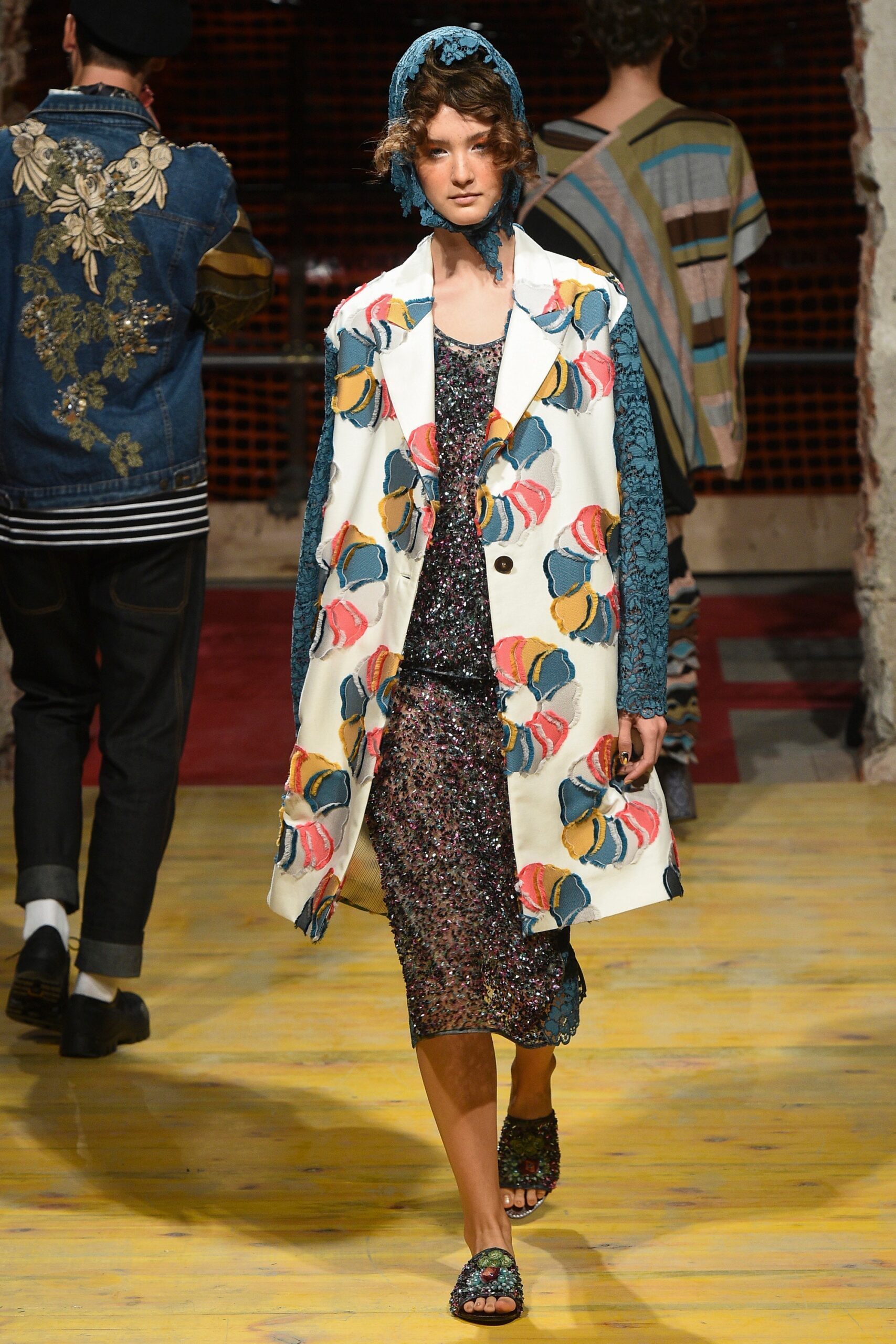 multi-colored coat and sequined dress