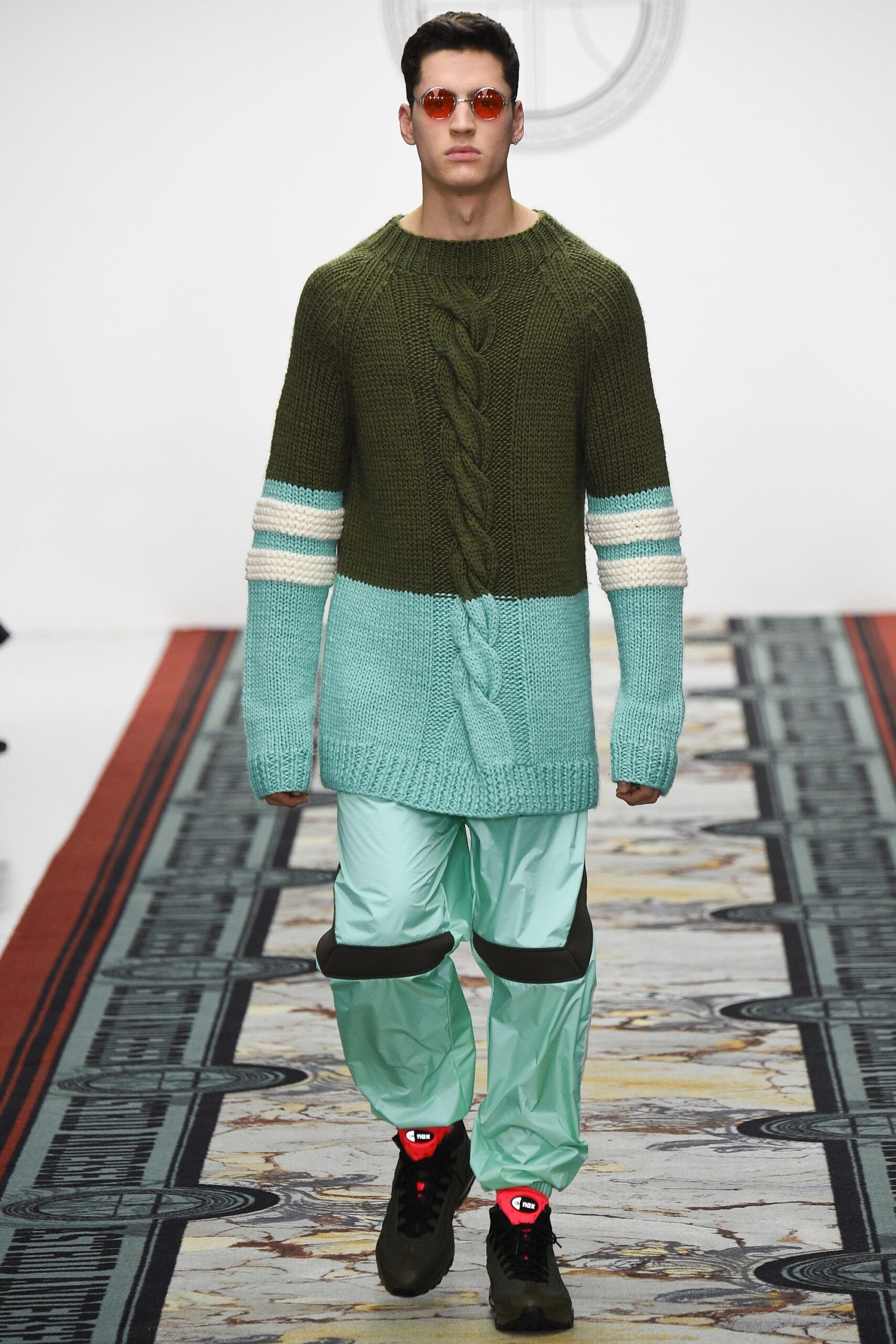 green and blue knit sweater with cargo pants